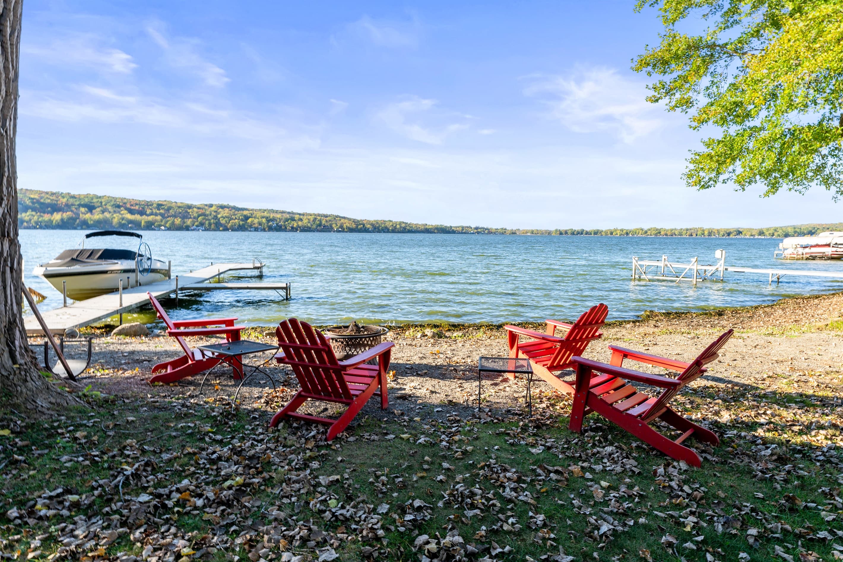 Lakeside fire pit with Adirondack chairs