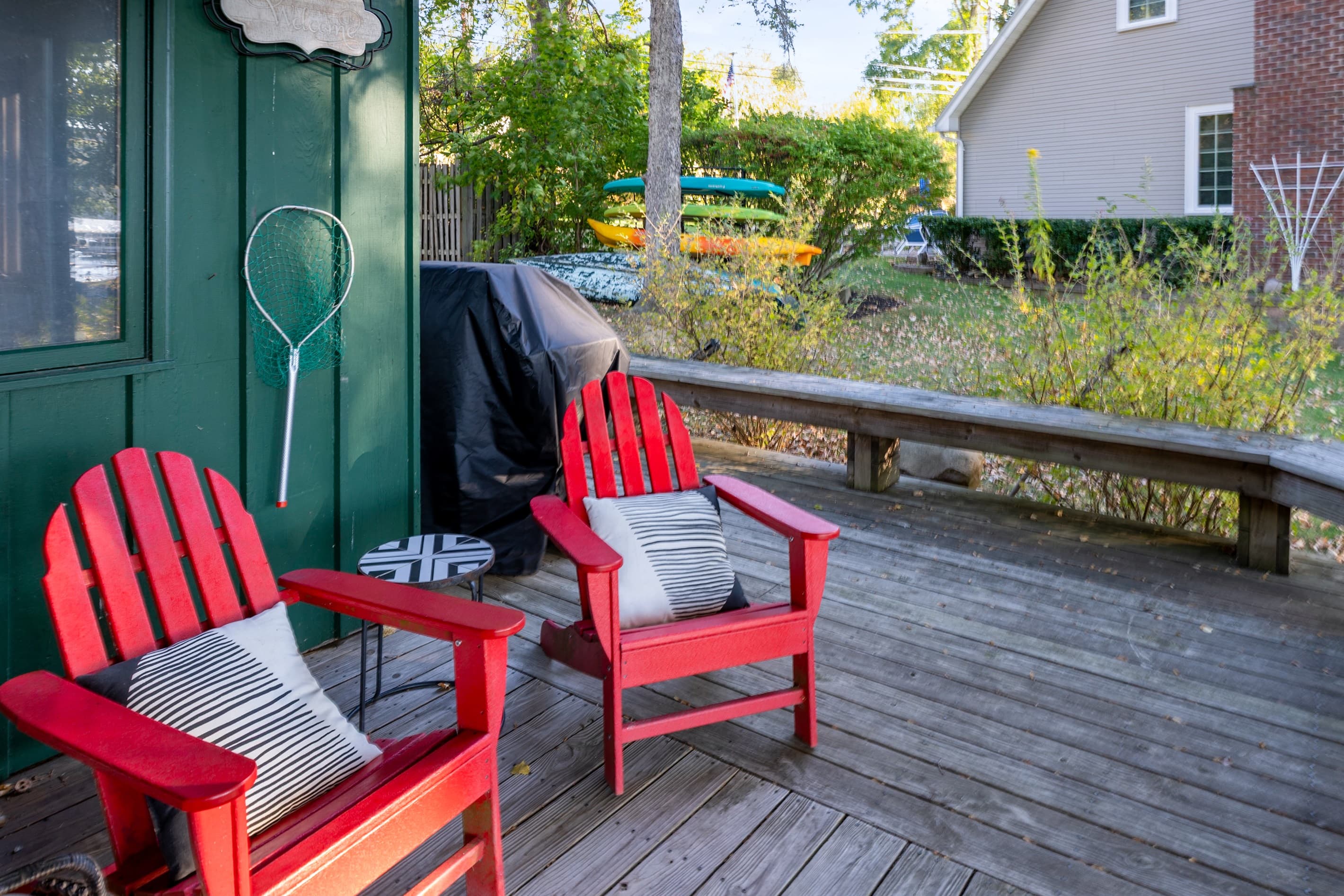 Deck with red Adirondack chairs