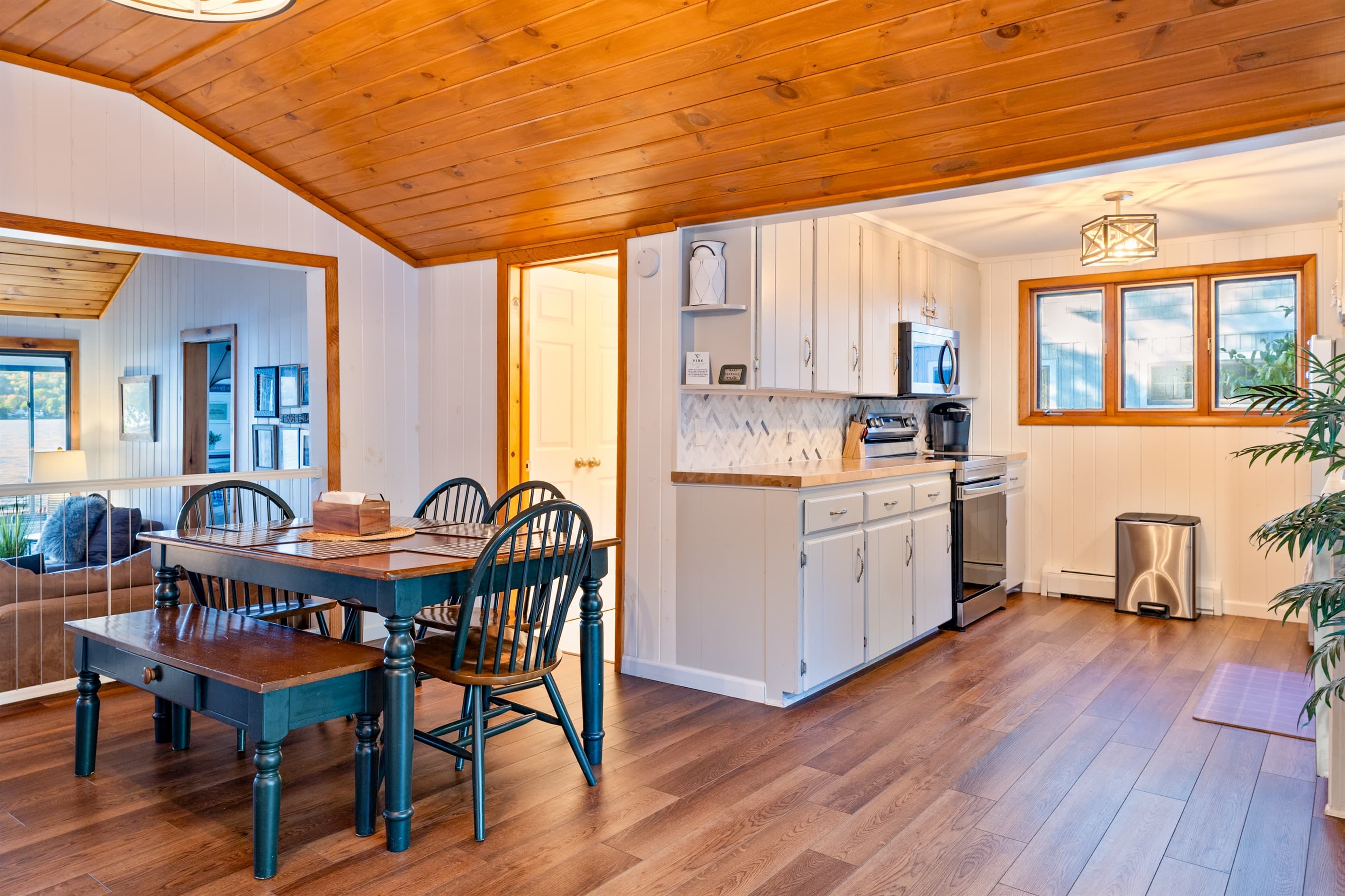 Open kitchen with dining table and a bench