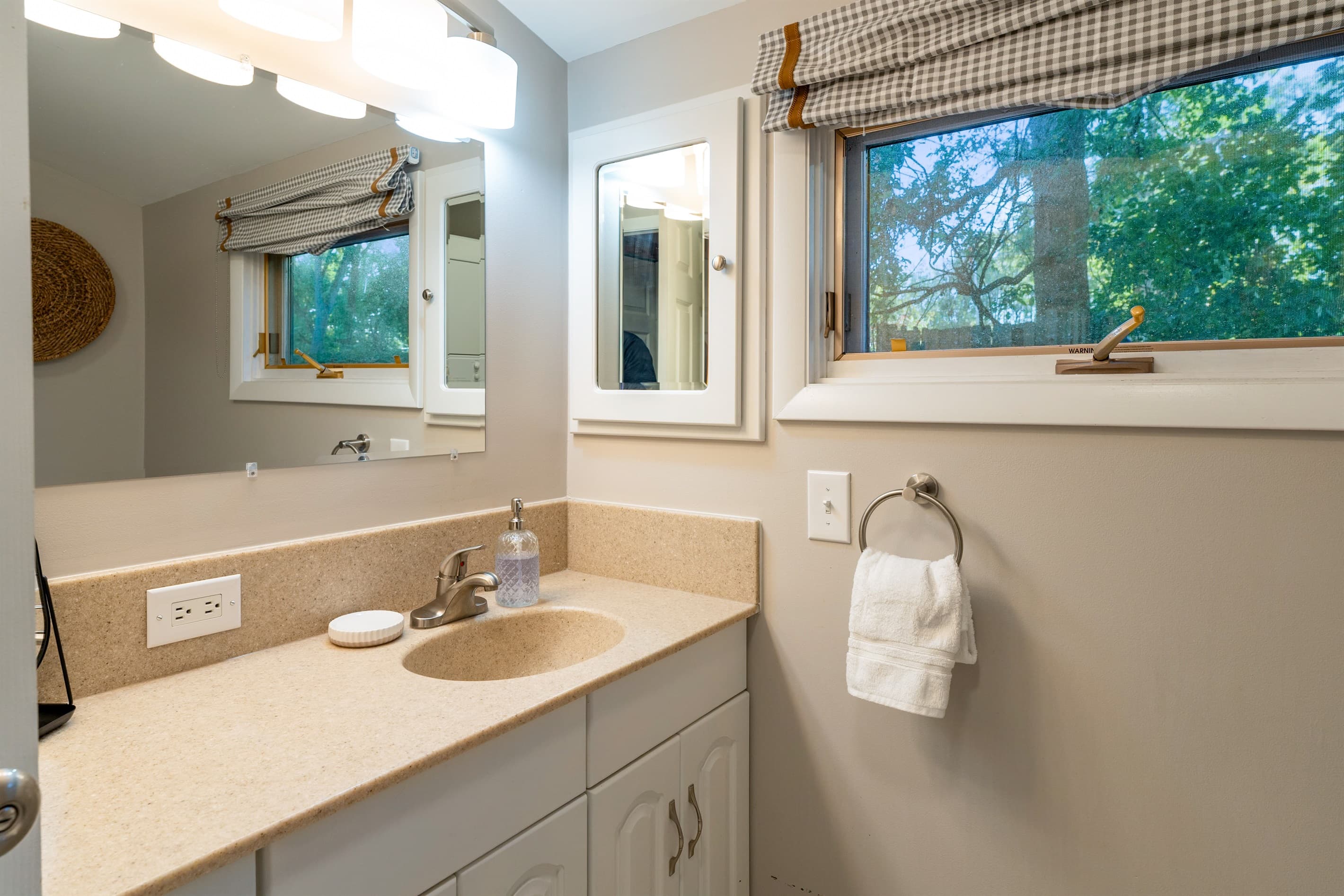 Powder room with window and vanity