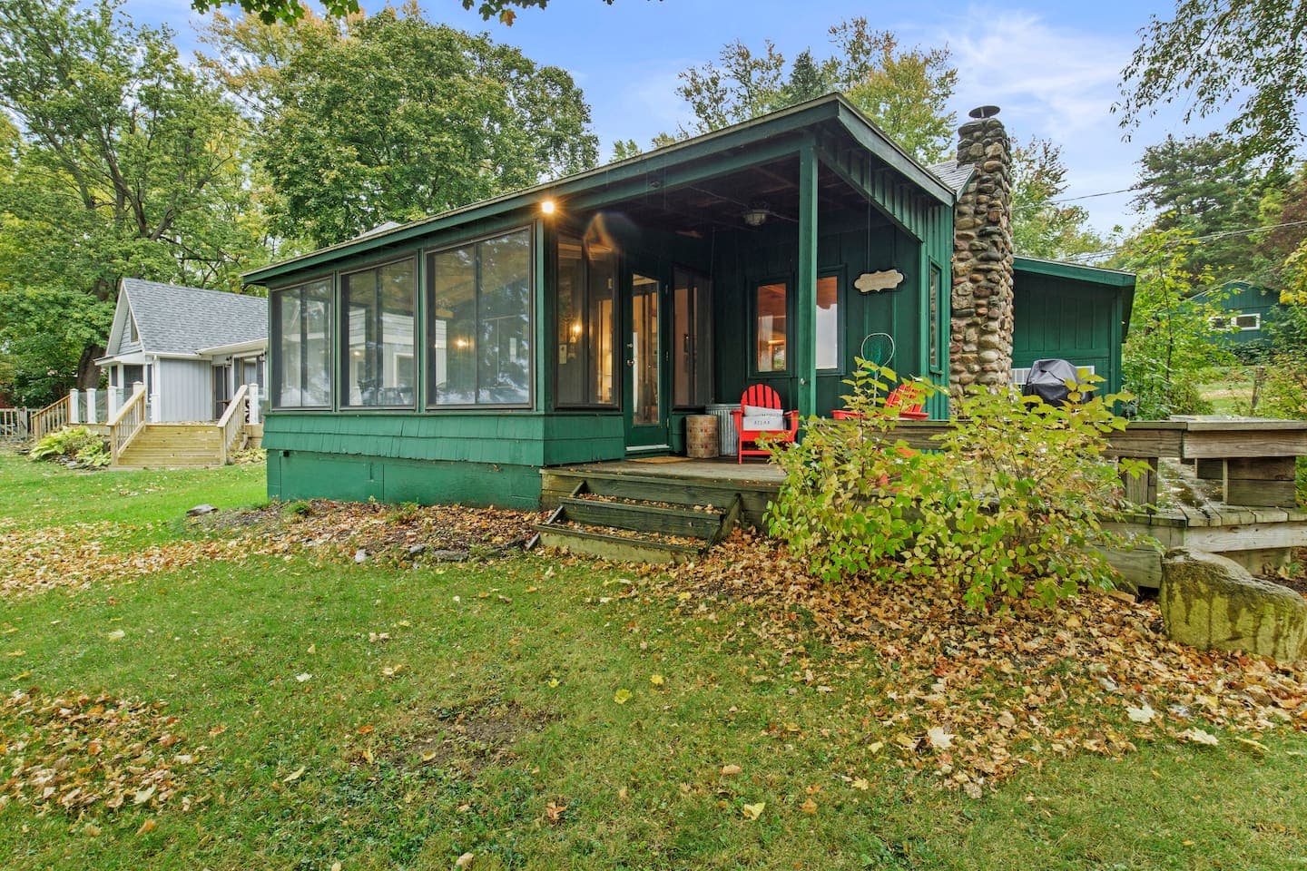Green exterior with screened porch