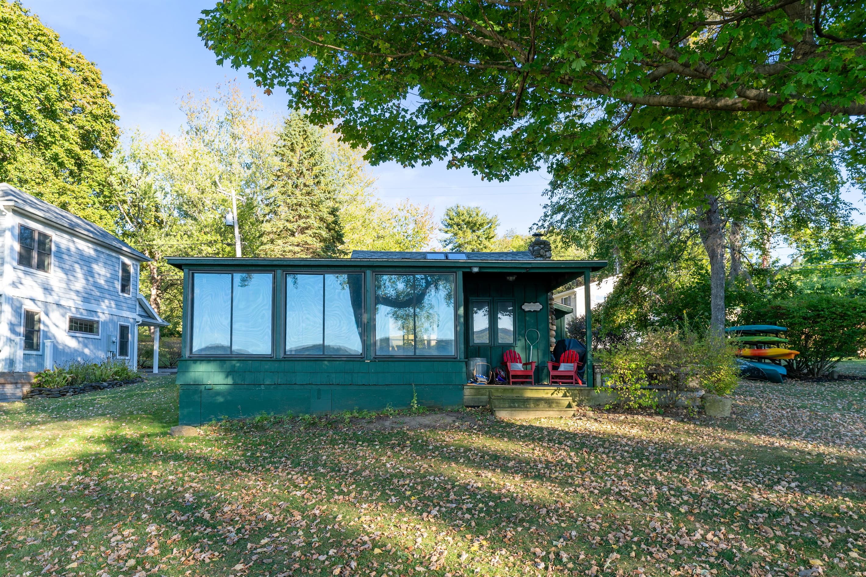Lakeside exterior surrounded by mature trees