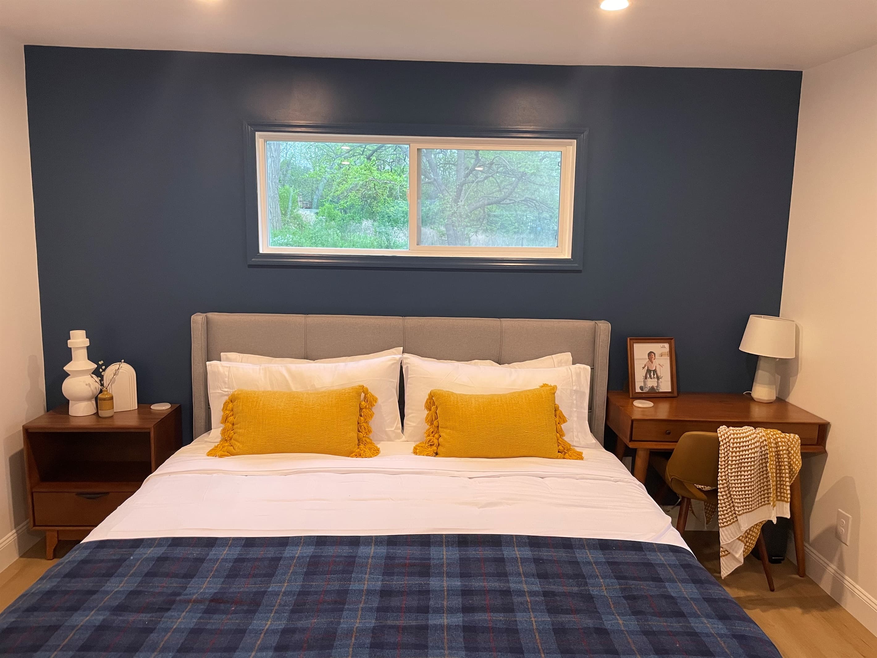 Bedroom with yellow accent pillows