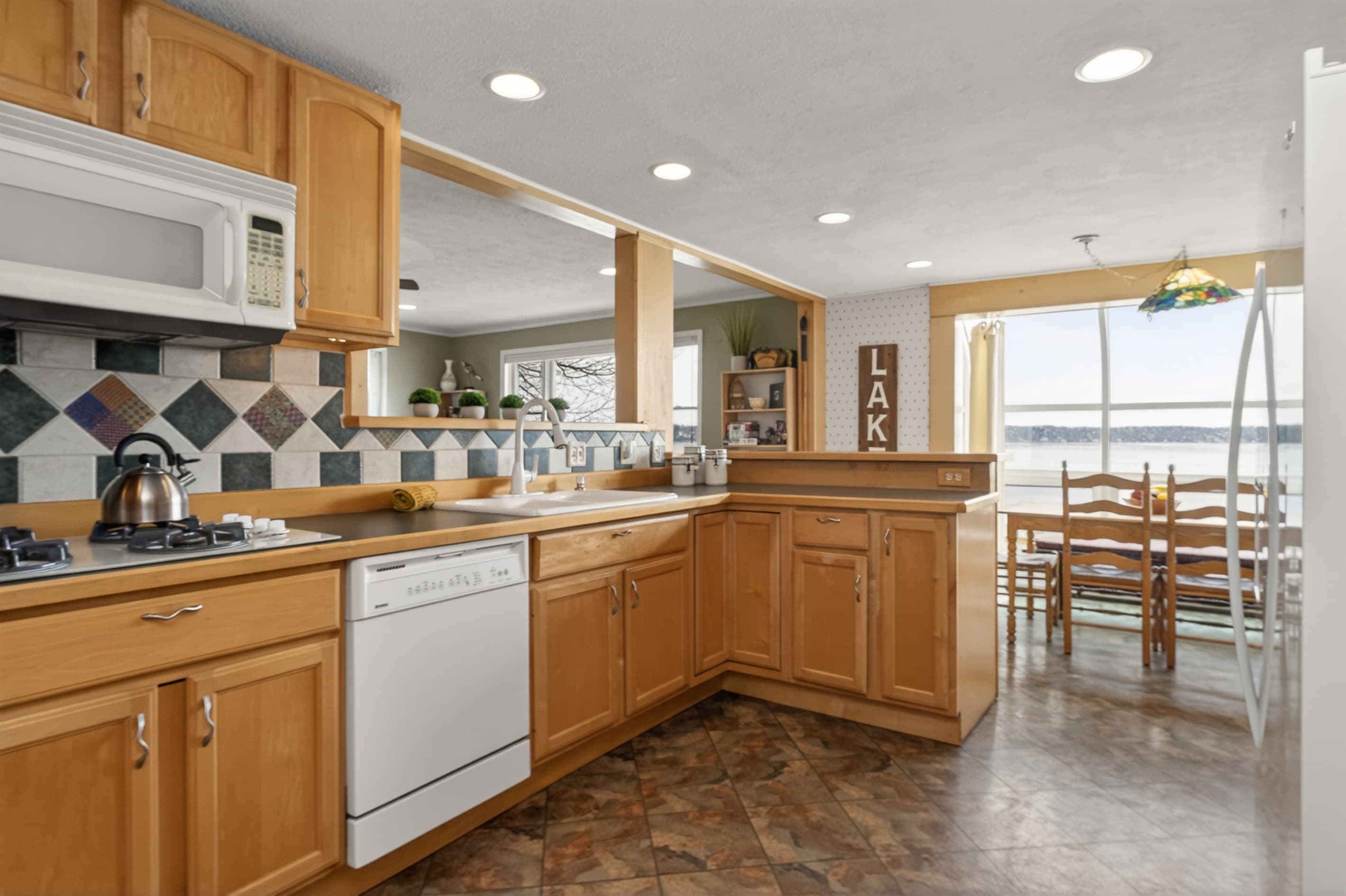 Kitchen with wood cabinetry and island