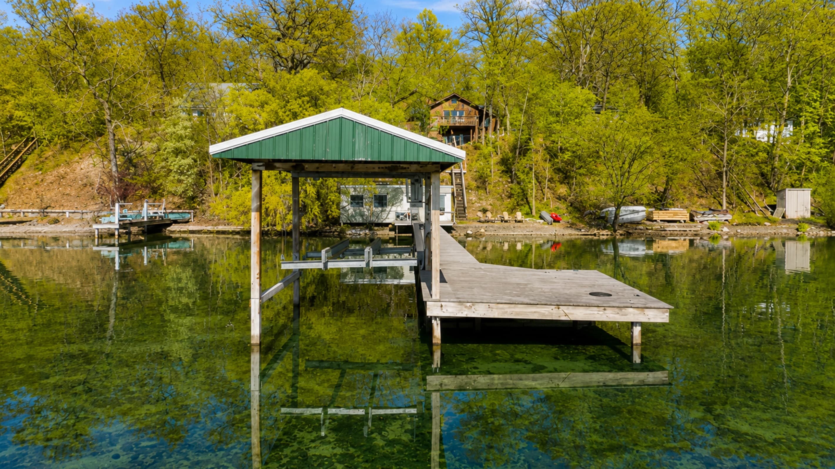 Lakeside boathouse with covered deck