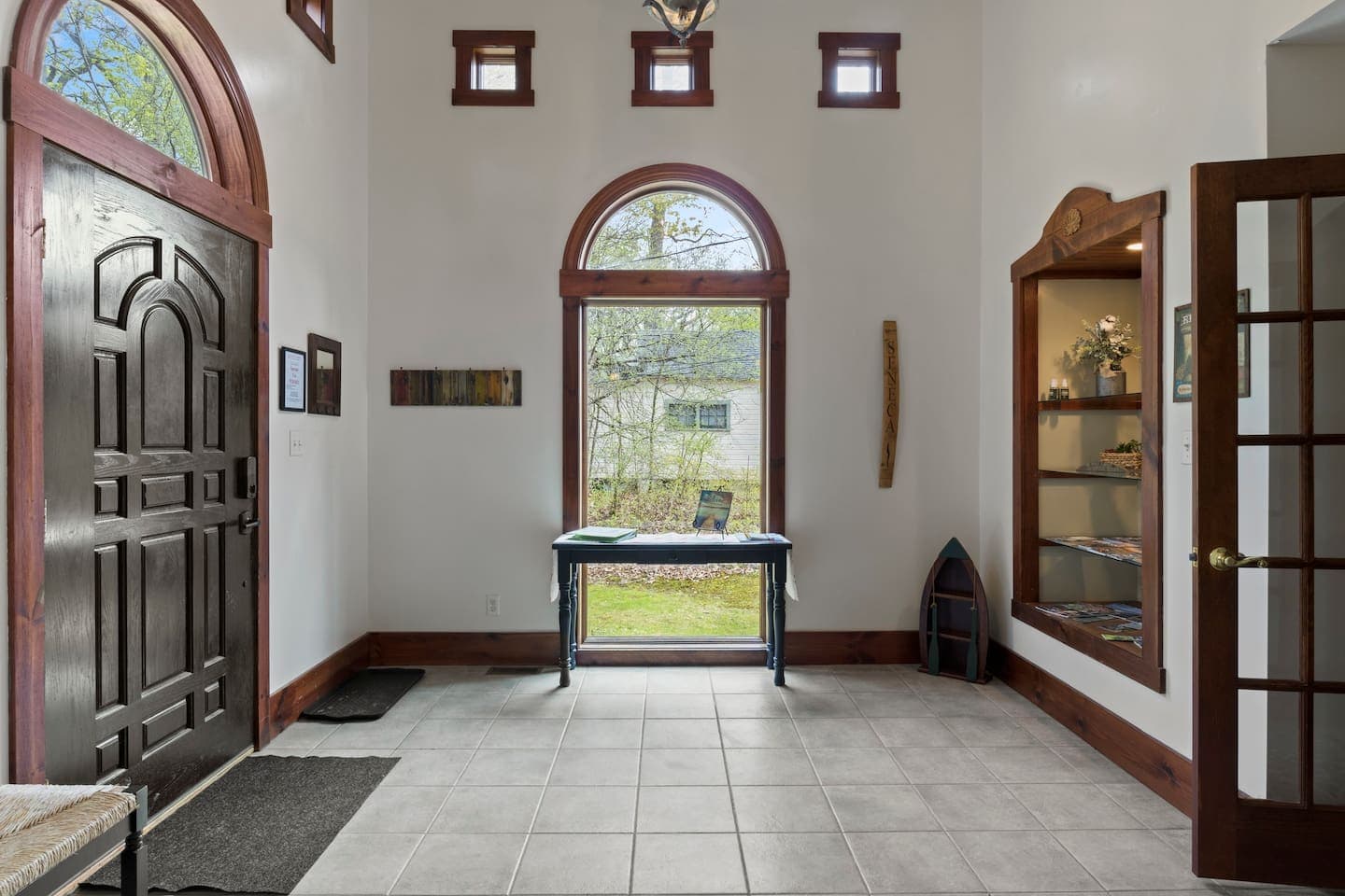 Second-floor entrance with arched window