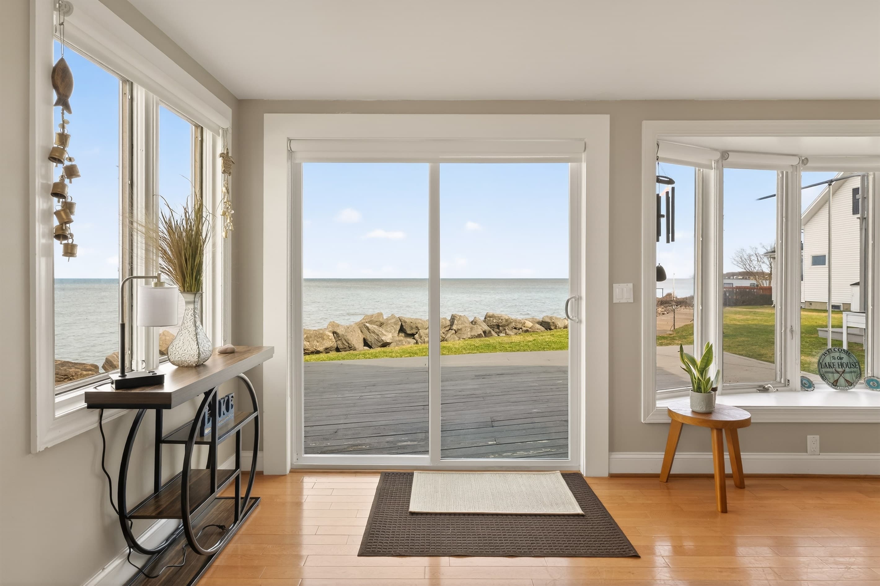 Glass doors opening toward the water