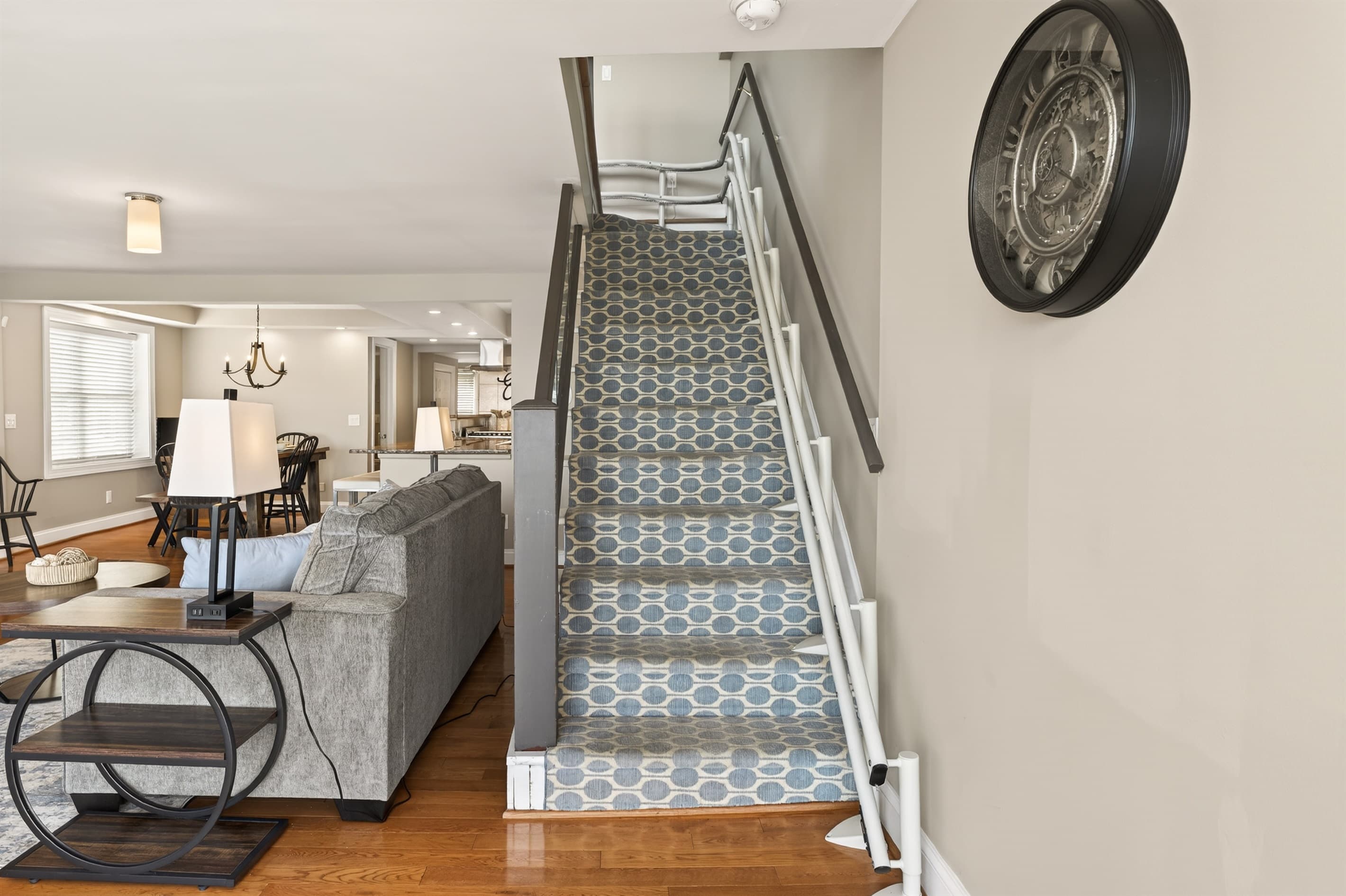 Carpeted staircase beside the living area