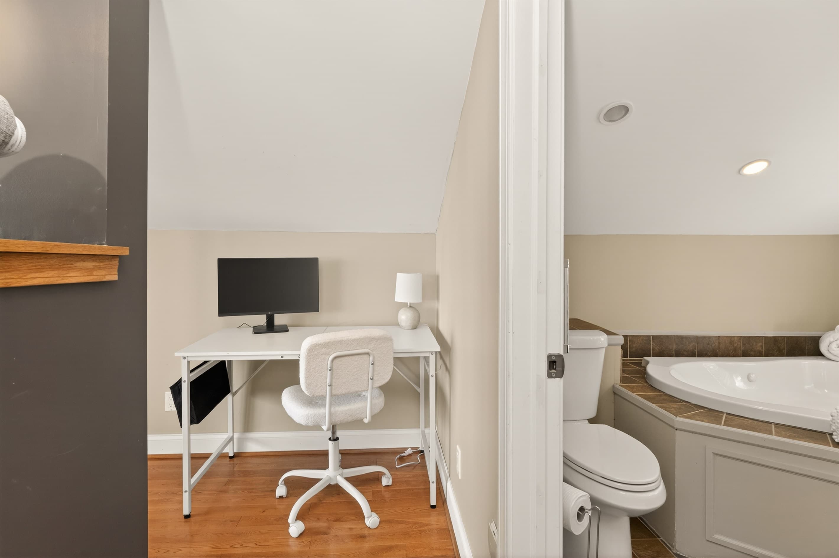 Desk workspace beside the bathroom doorway