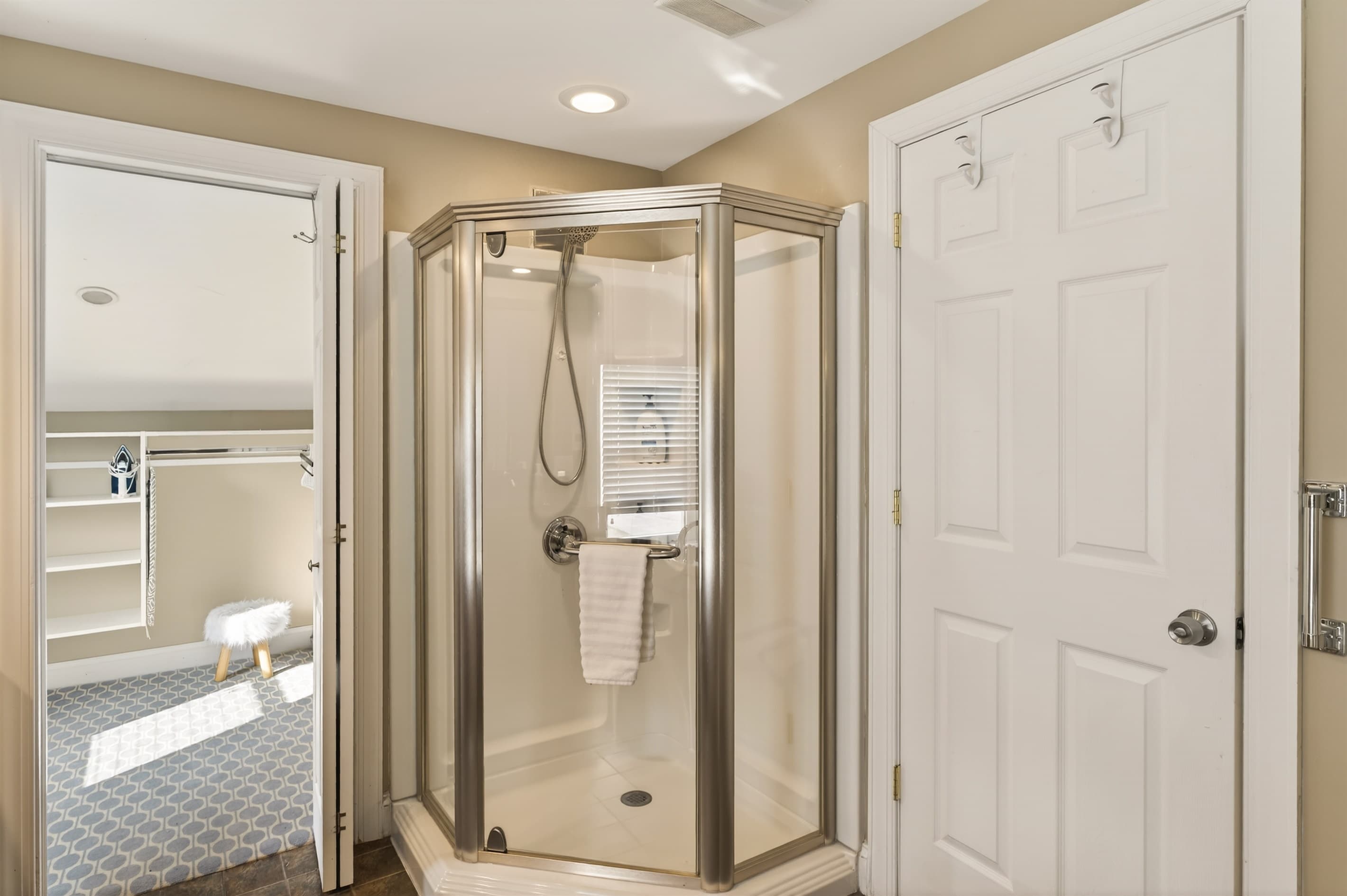 Bathroom with glass-enclosed corner shower