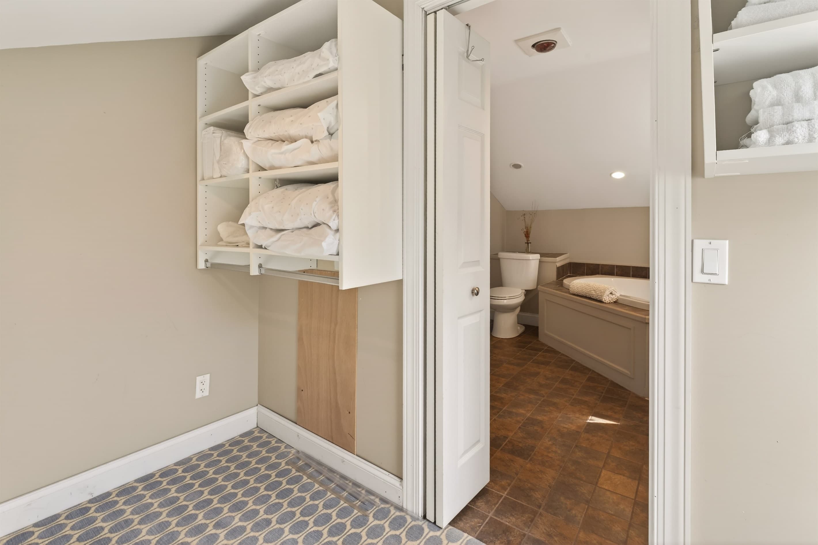 Linen closet beside the bathroom doorway