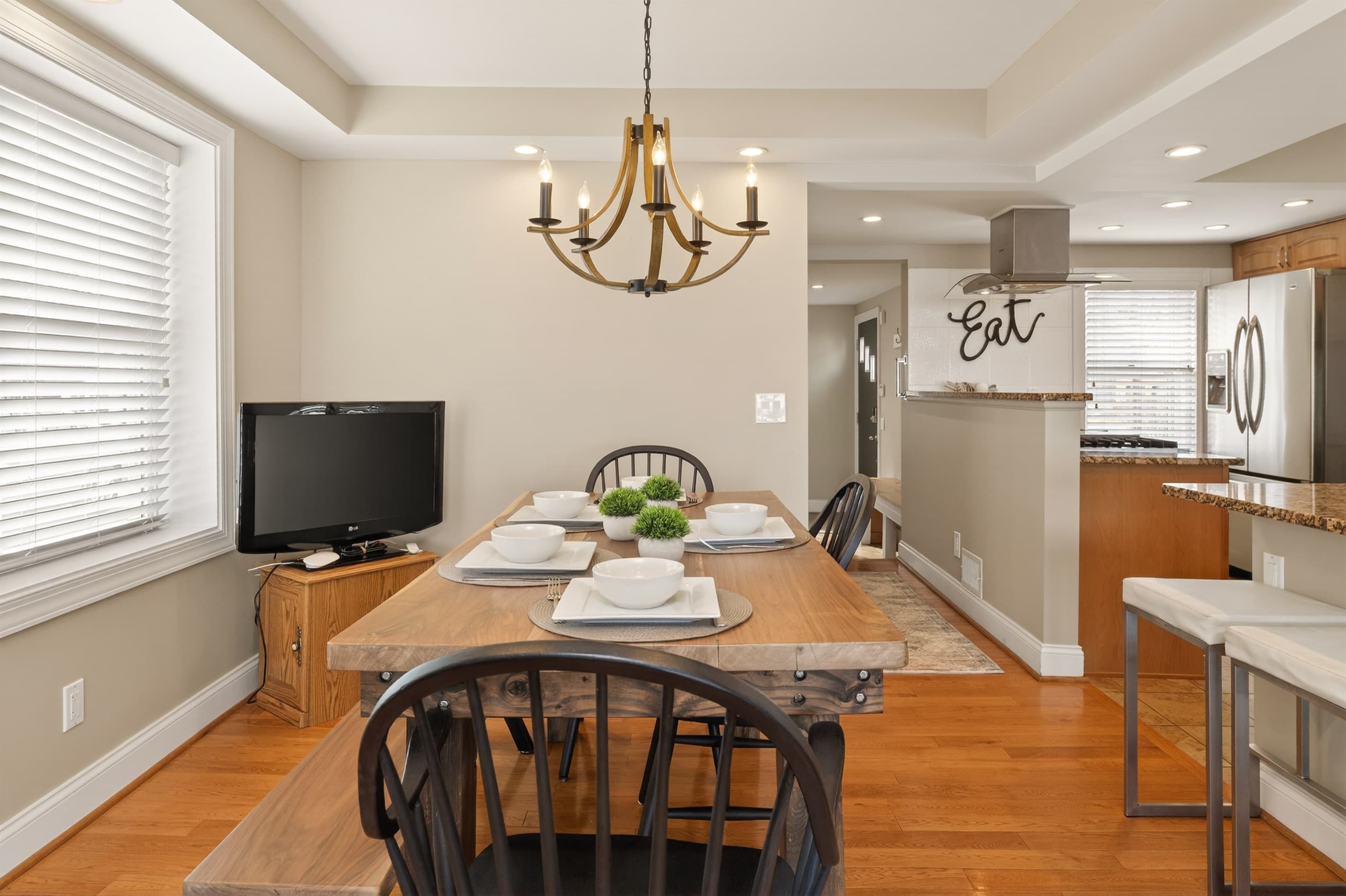 Dining table beside the open kitchen