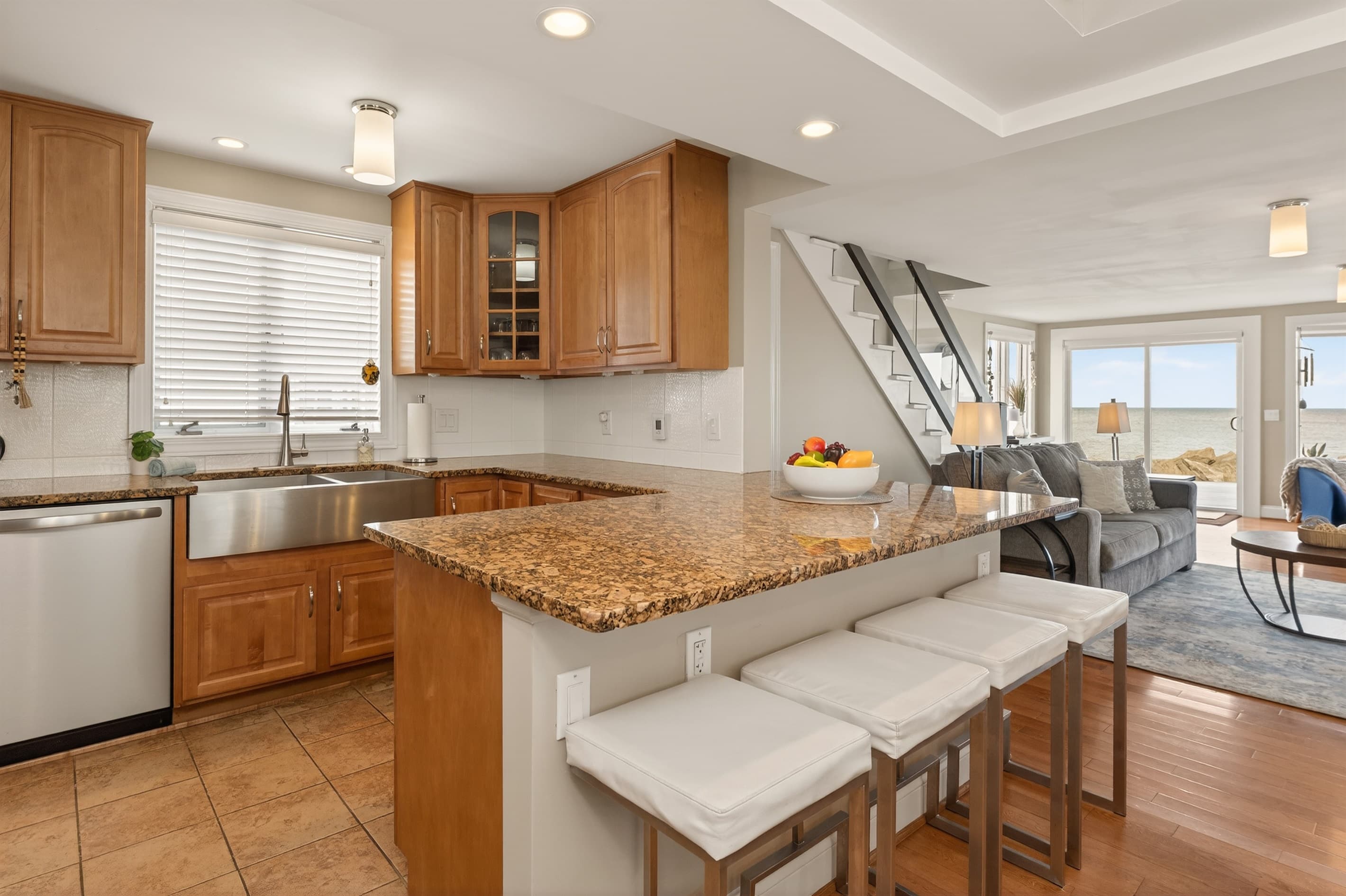 Kitchen peninsula with granite countertop seating