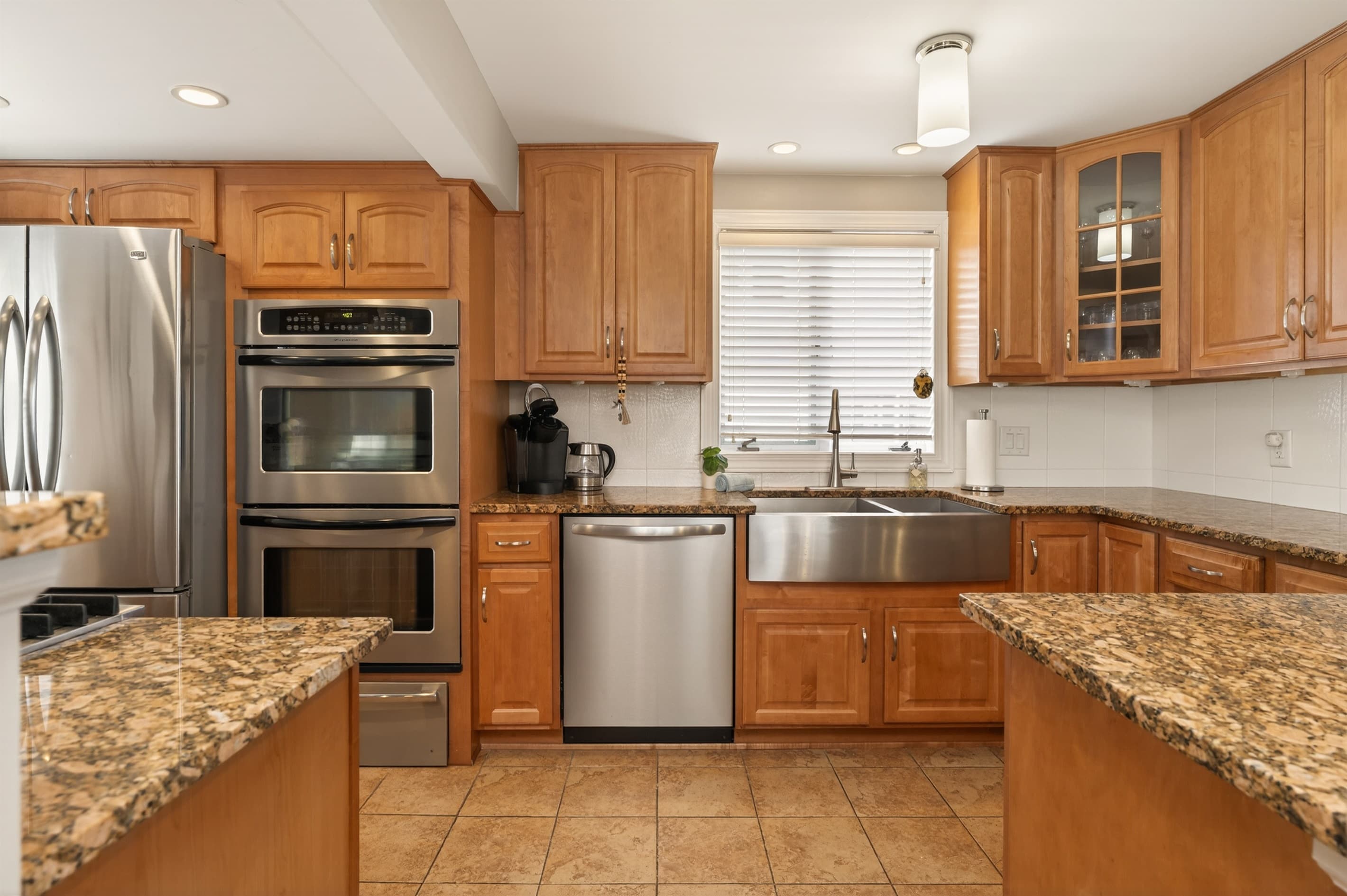 Kitchen sink with granite countertops and dishwasher