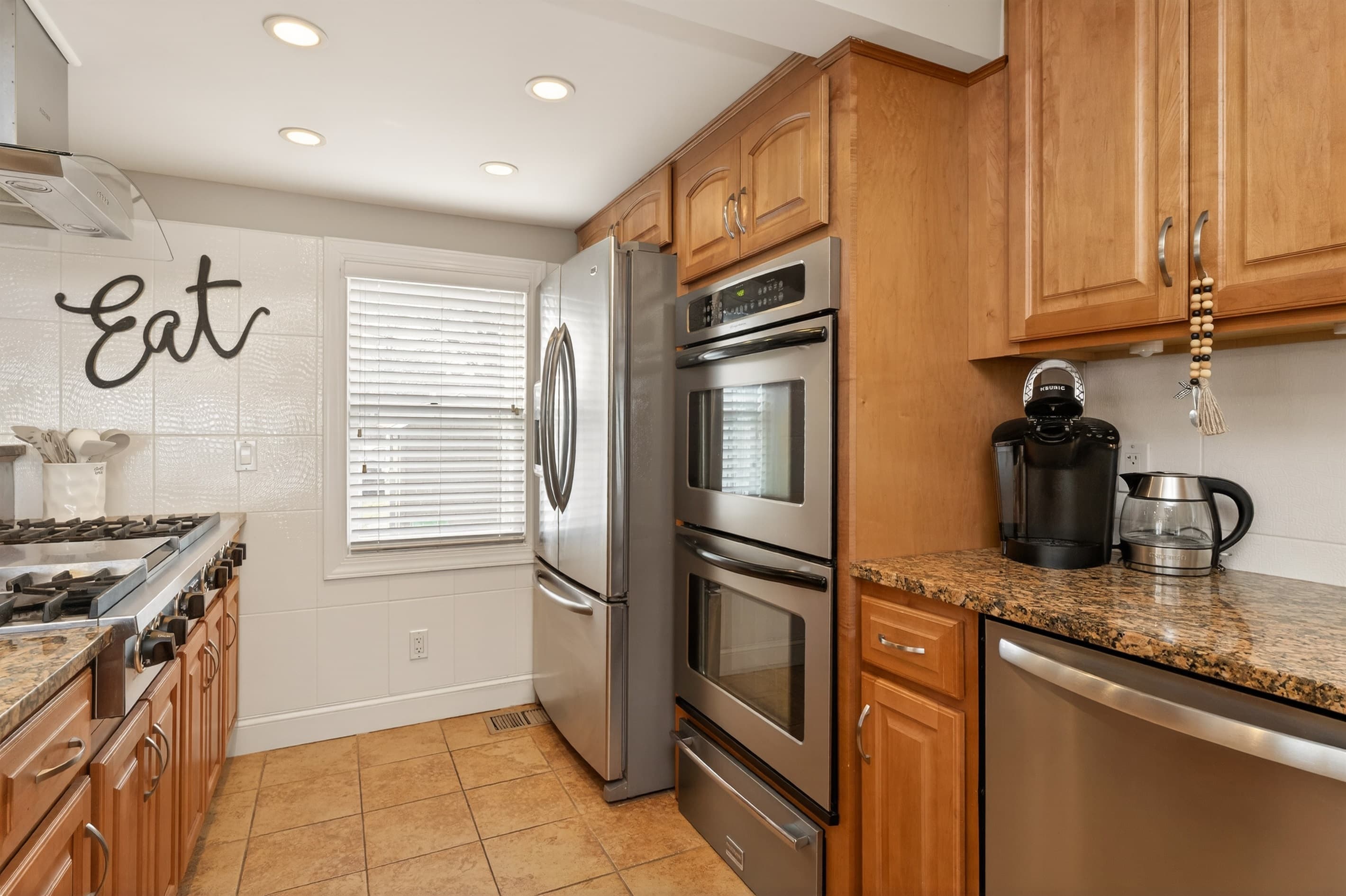 Refrigerator beside countertop coffee station