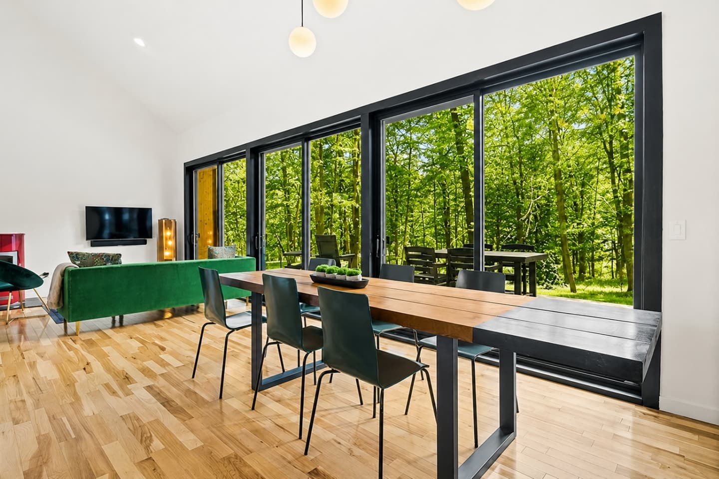 Dining area with floor-to-ceiling forest views