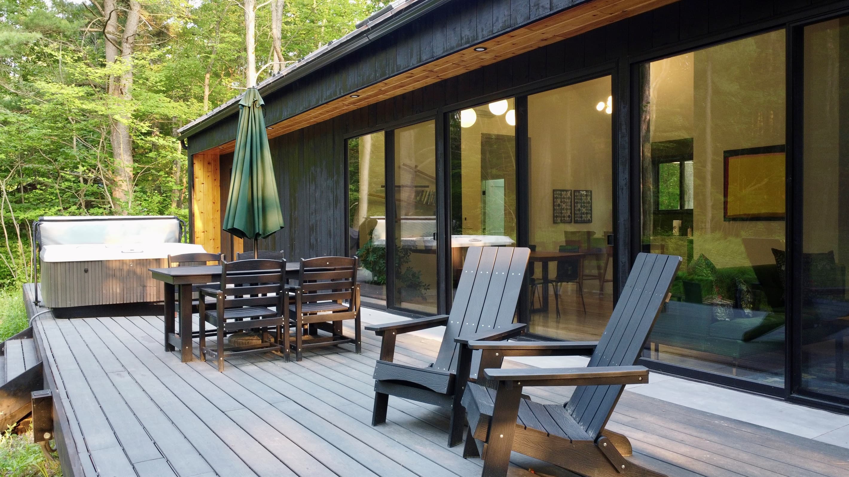 Front deck with dining, lounge seating and hot tub