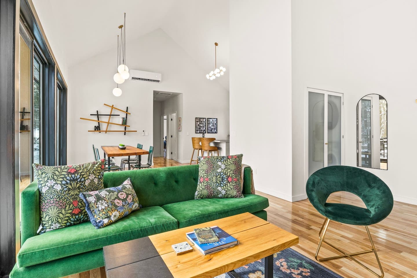 Living room with green sectional seating