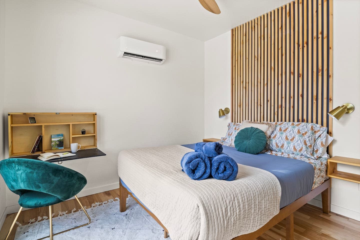 Bedroom with a dedicated workspace and wood accent wall