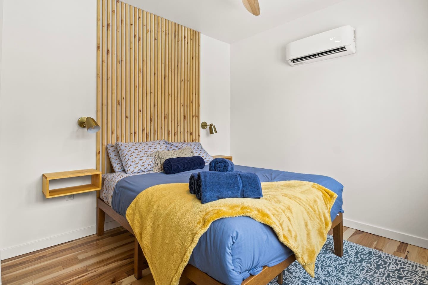 Bedroom with blue and yellow bedding