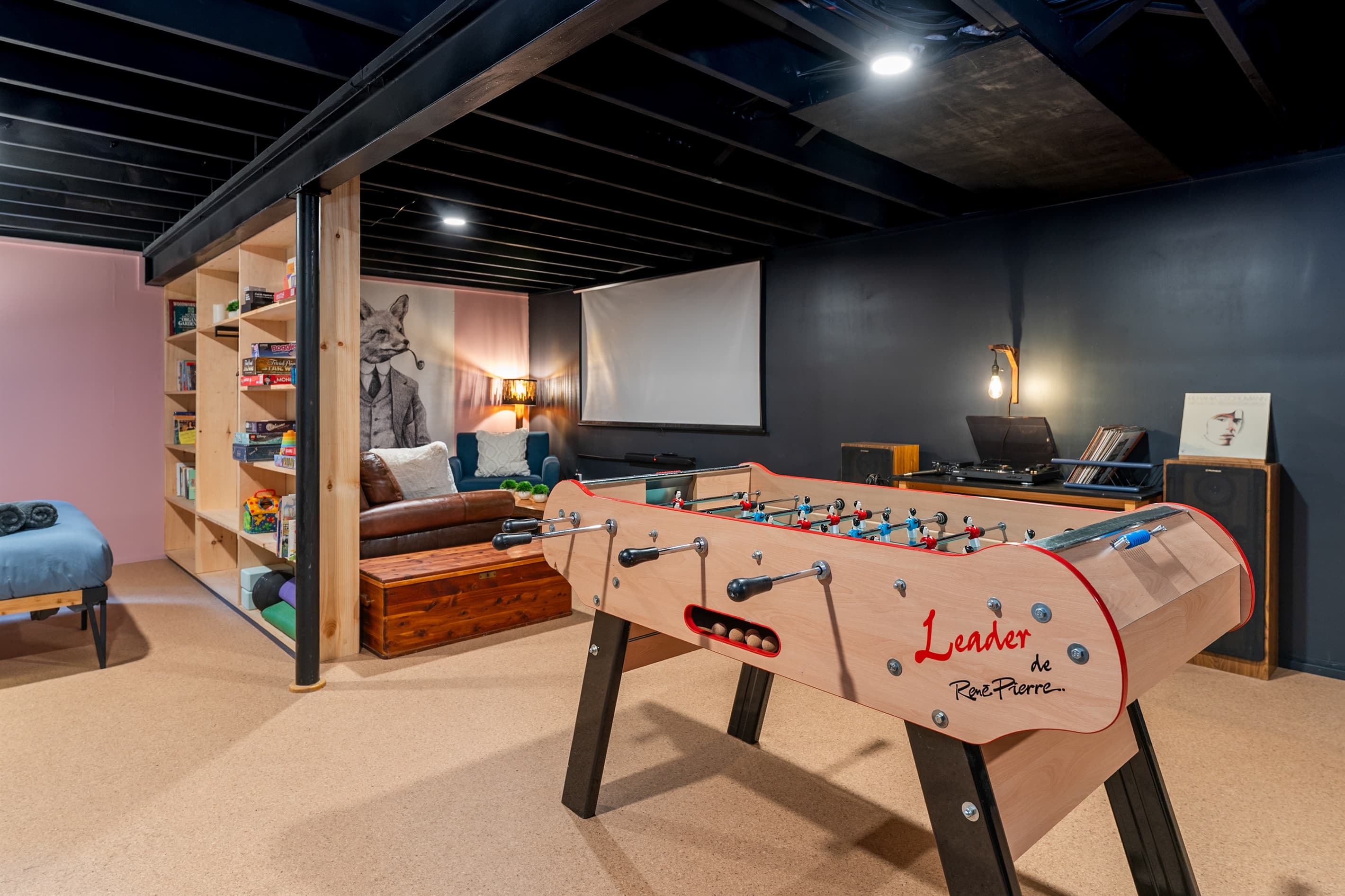 Game area with foosball and built-in shelving
