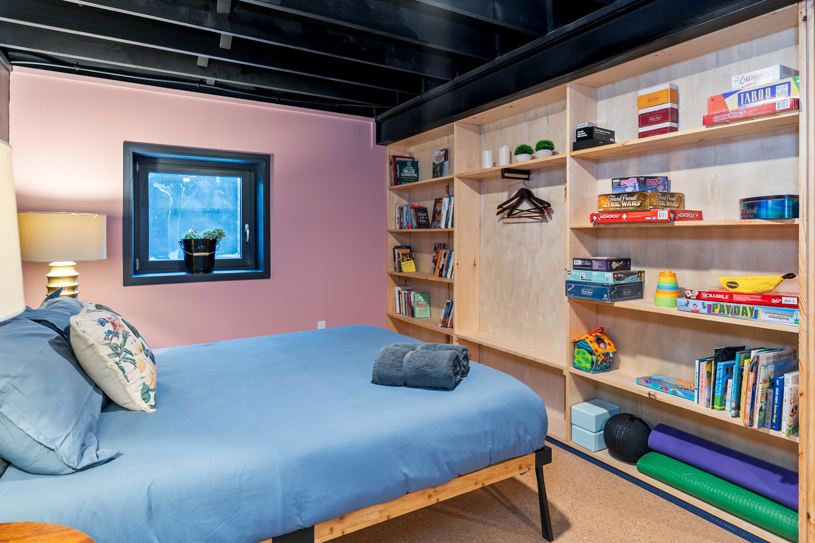 Bedroom with colorful built-in shelving