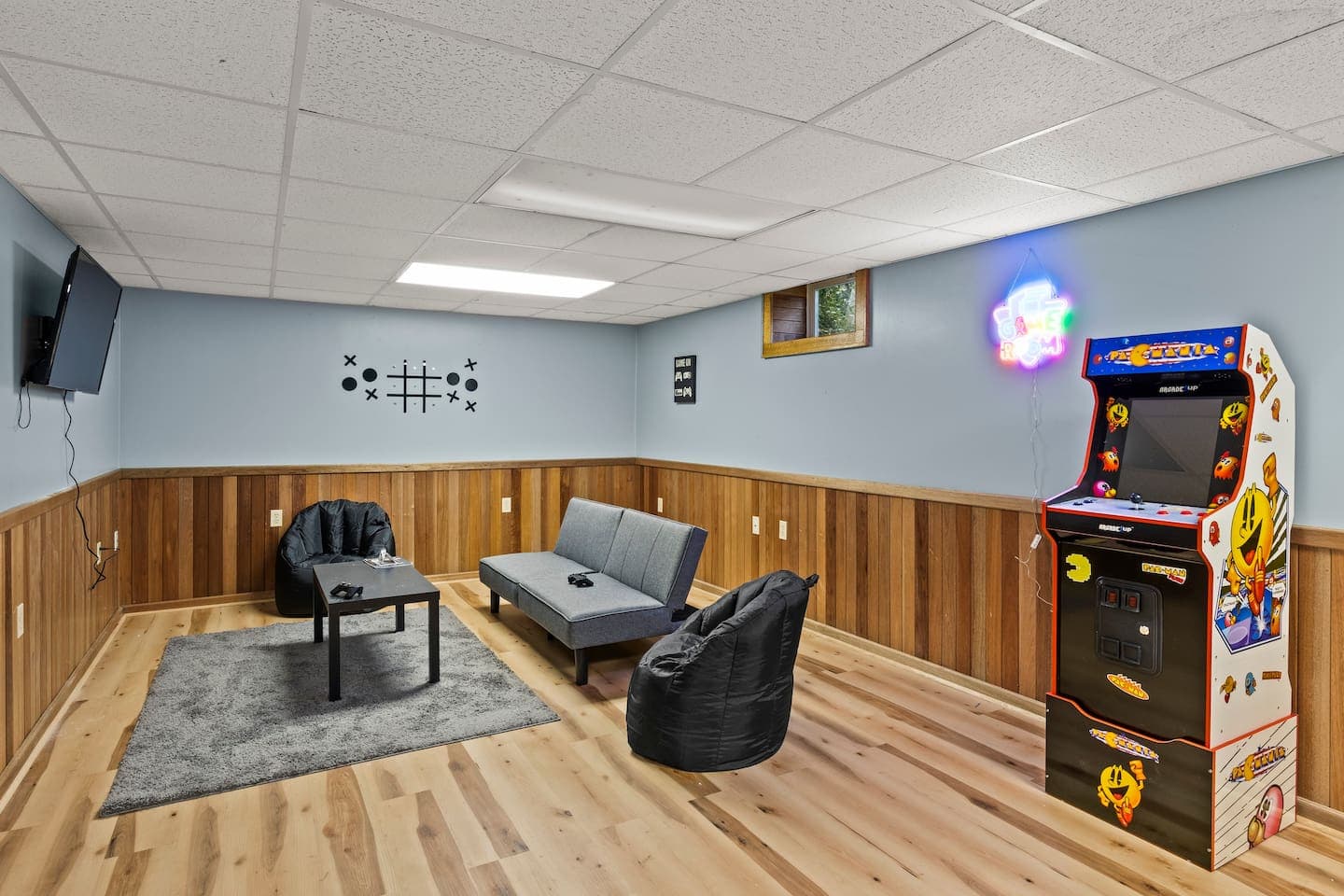 Game room with arcade machine and foosball