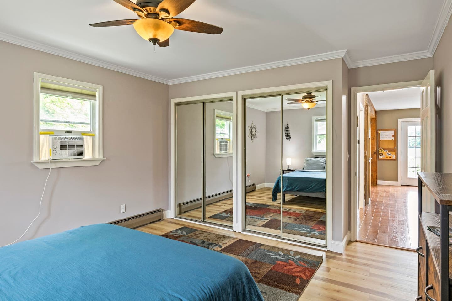 Bedroom with mirrored closet doors