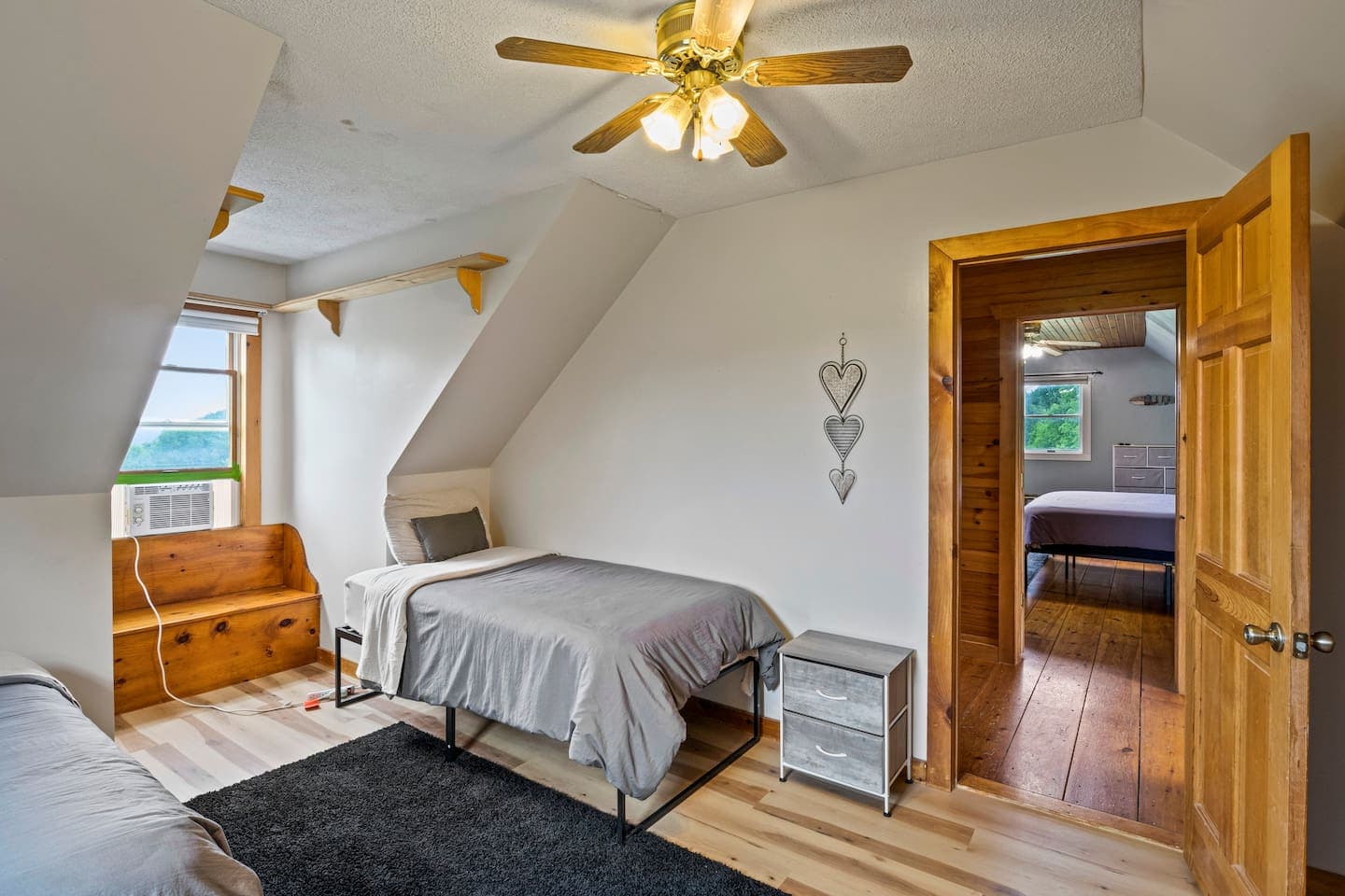 Two-bed room with wood furniture