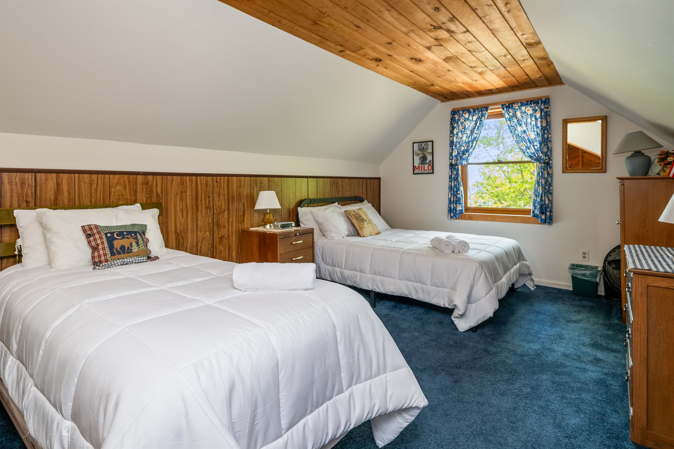 Bedroom with blue patterned curtain