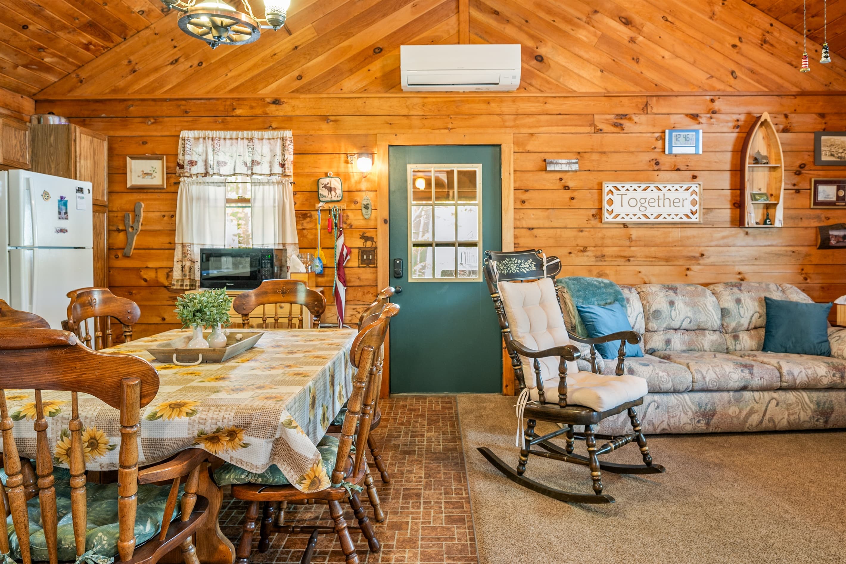 Wood-paneled living area with dining table