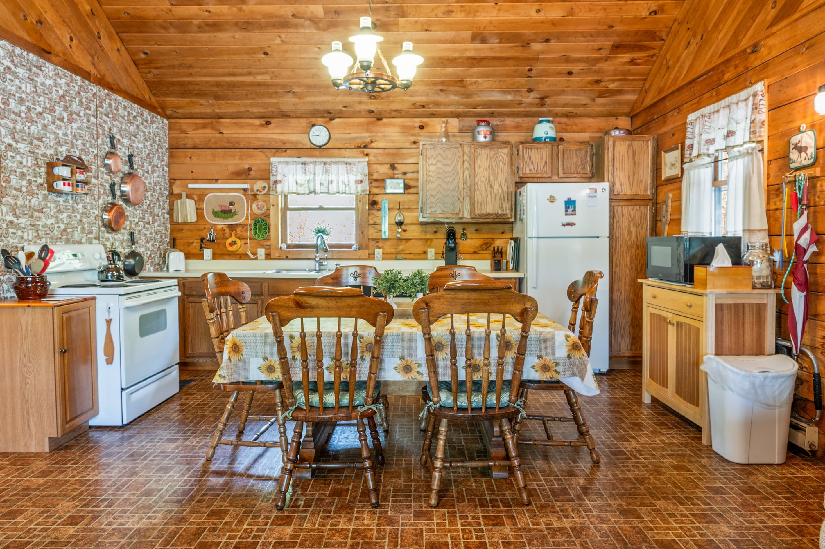 Kitchen with farmhouse table and patterned accent wall