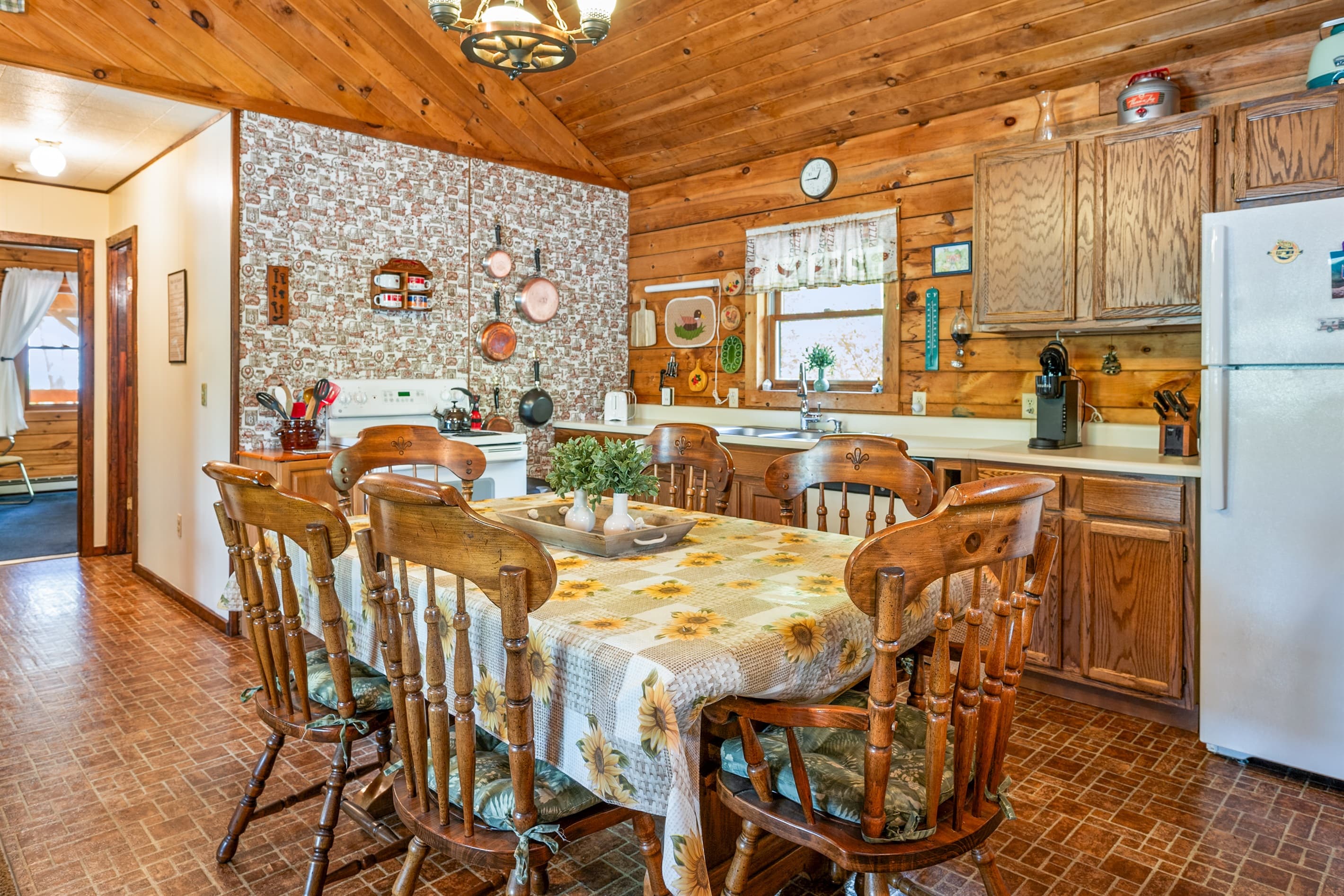 Farmhouse table beneath hanging light