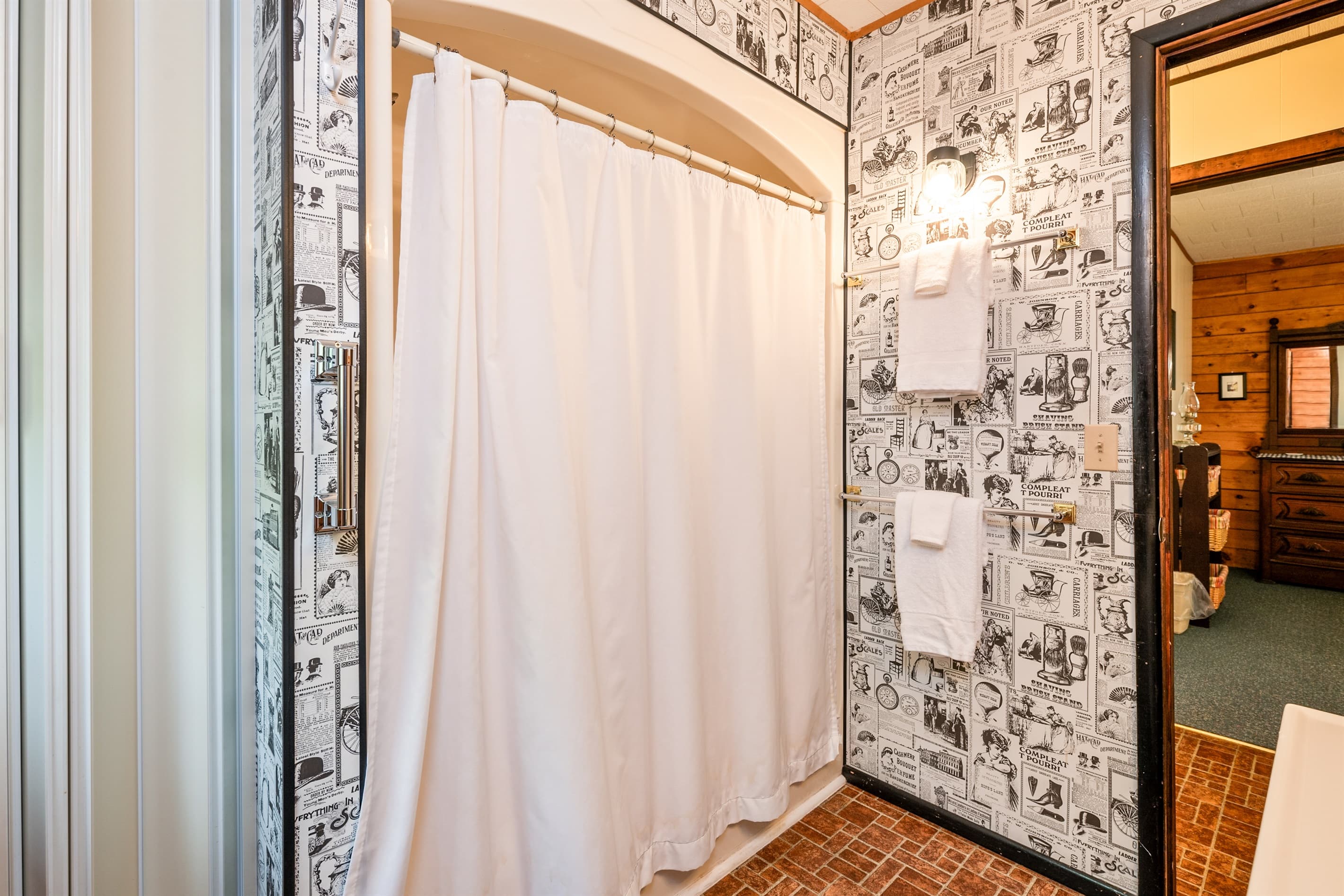 Glass shower with patterned tile walls