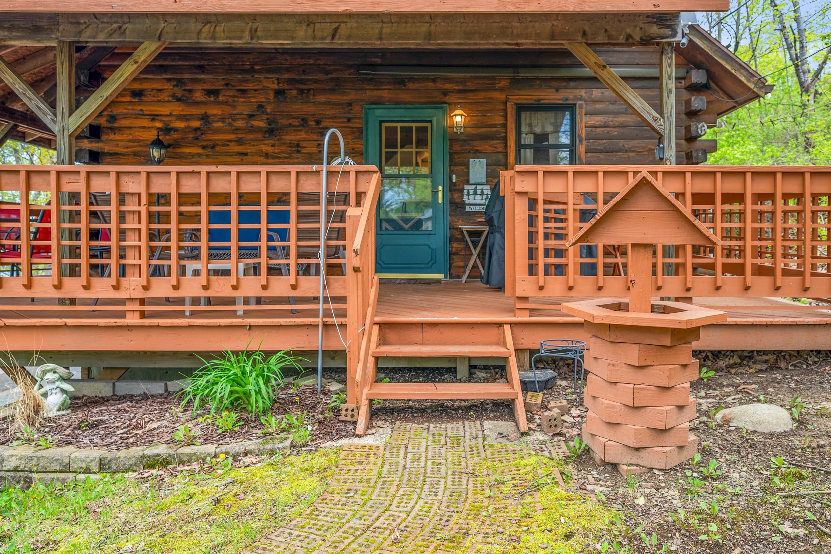 Log cabin exterior with wraparound porch