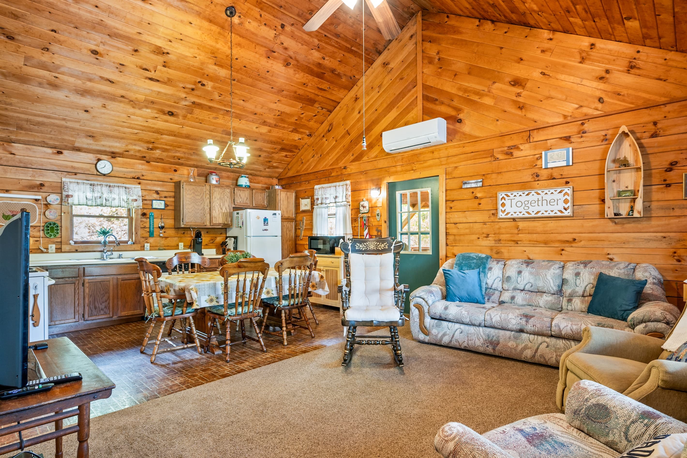 Living area with sofas and ceiling fan