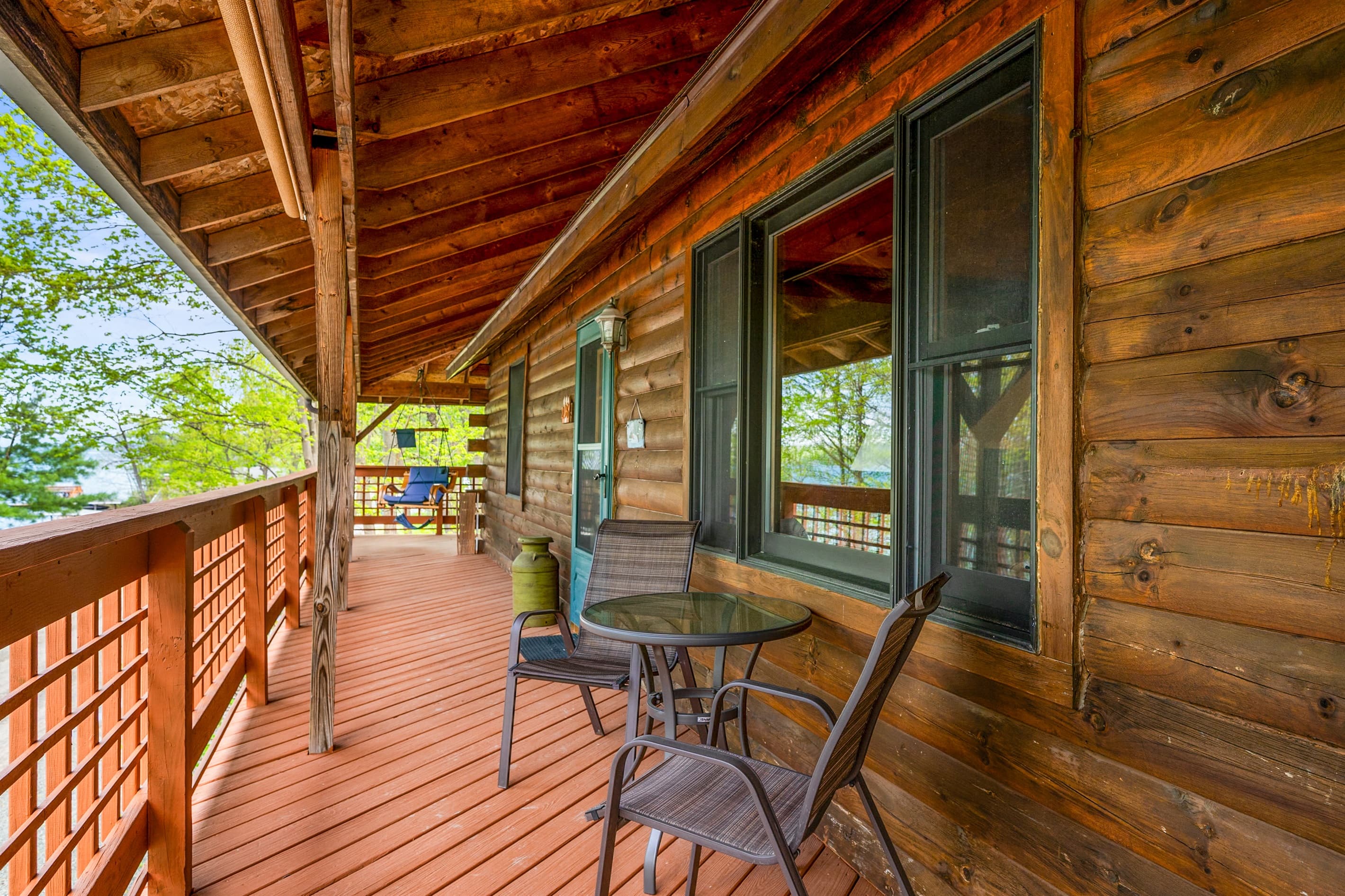 Covered porch with wooden railings