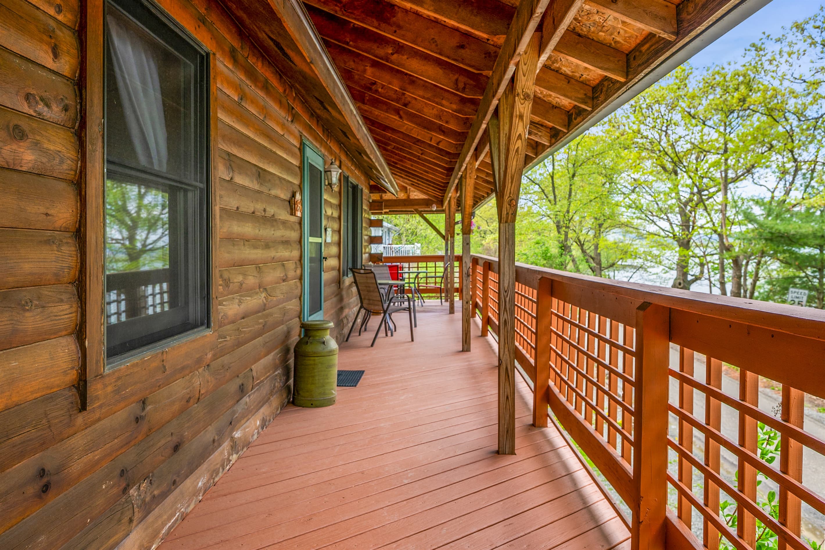 Covered porch overlooking surrounding trees
