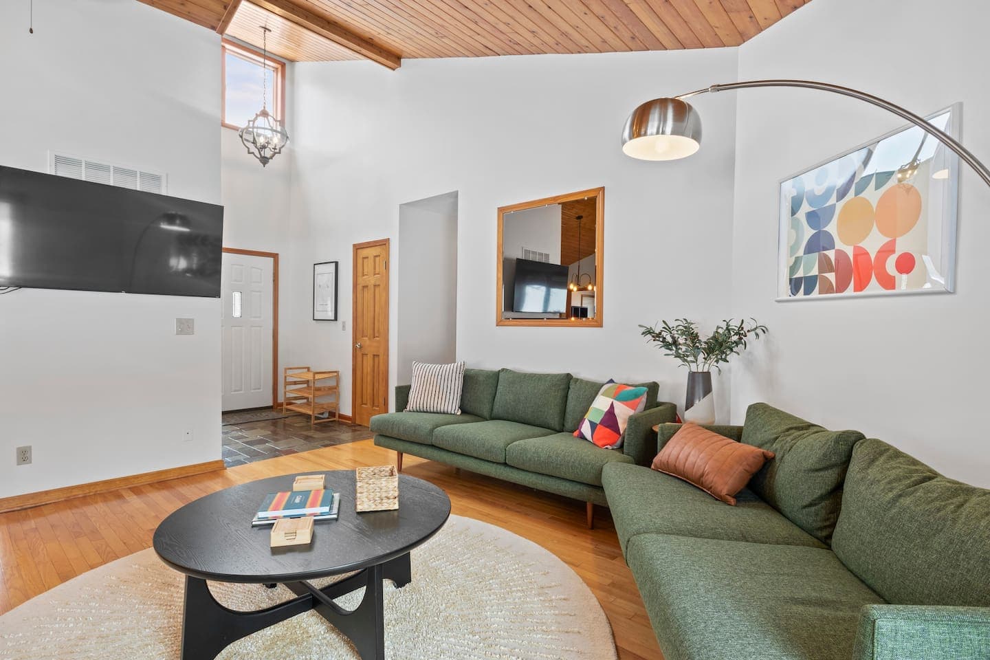 Living room with sectional seating and television