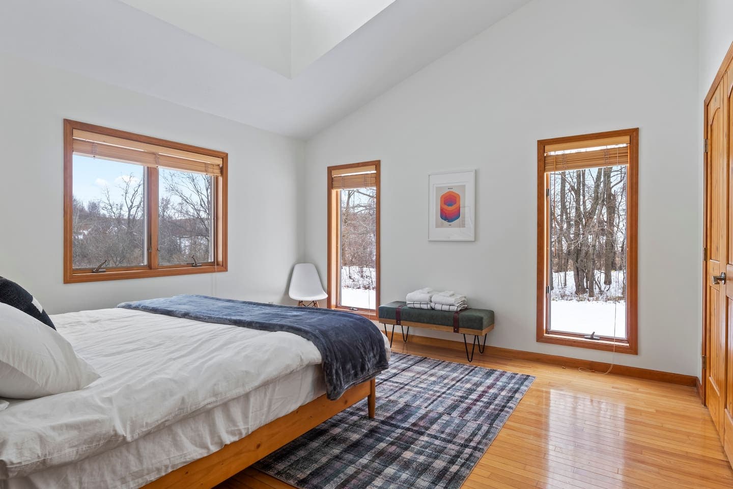 Bedroom surrounded by windows 