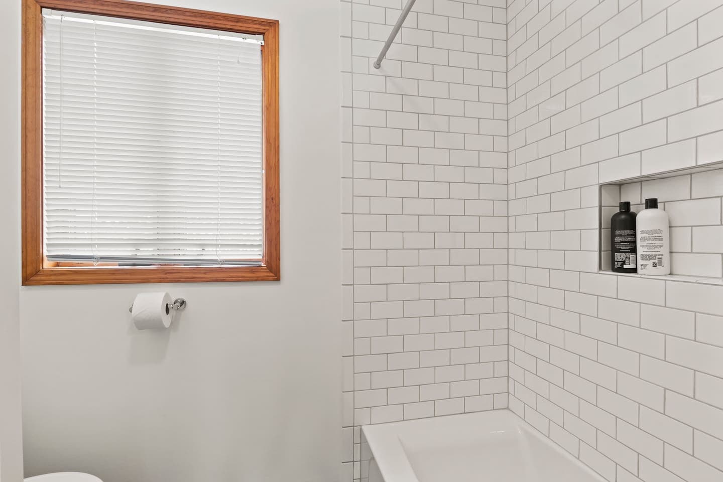 Subway-tiled shower with recessed shelf