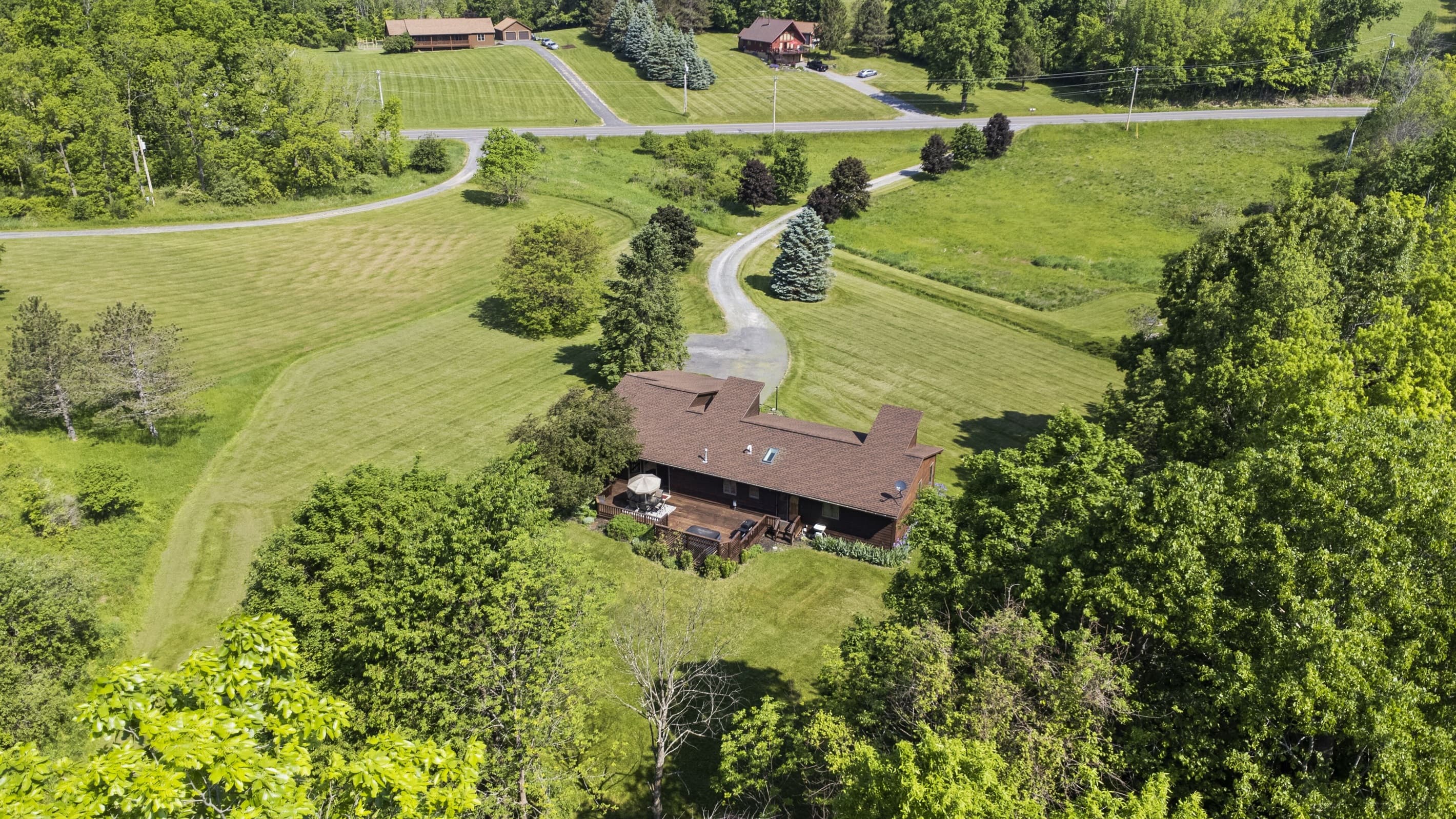 Overhead view of the home and curved driveway