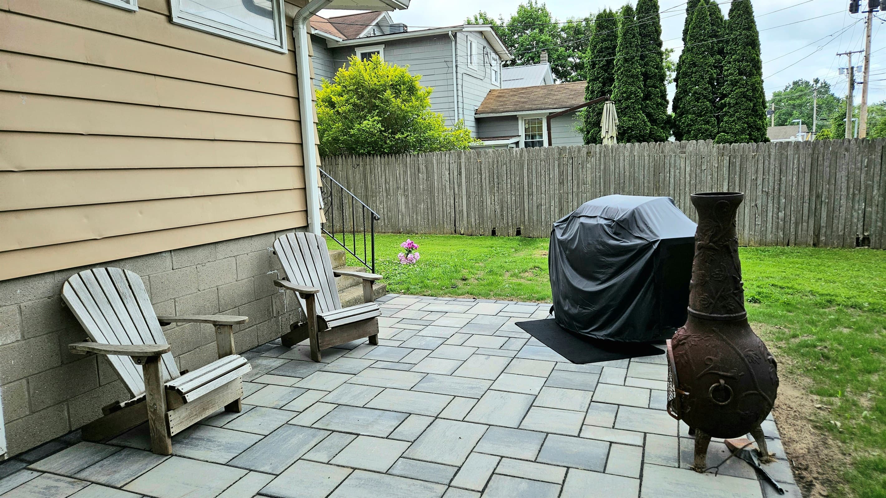 Paved patio with outdoor grill