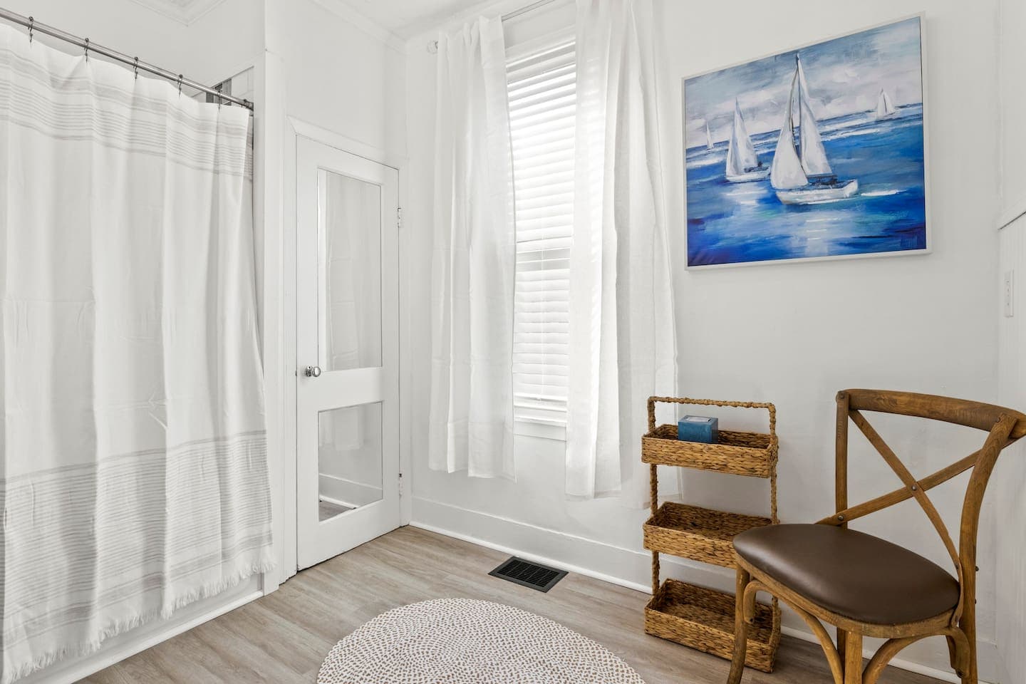 Bathroom with natural light and wood chair