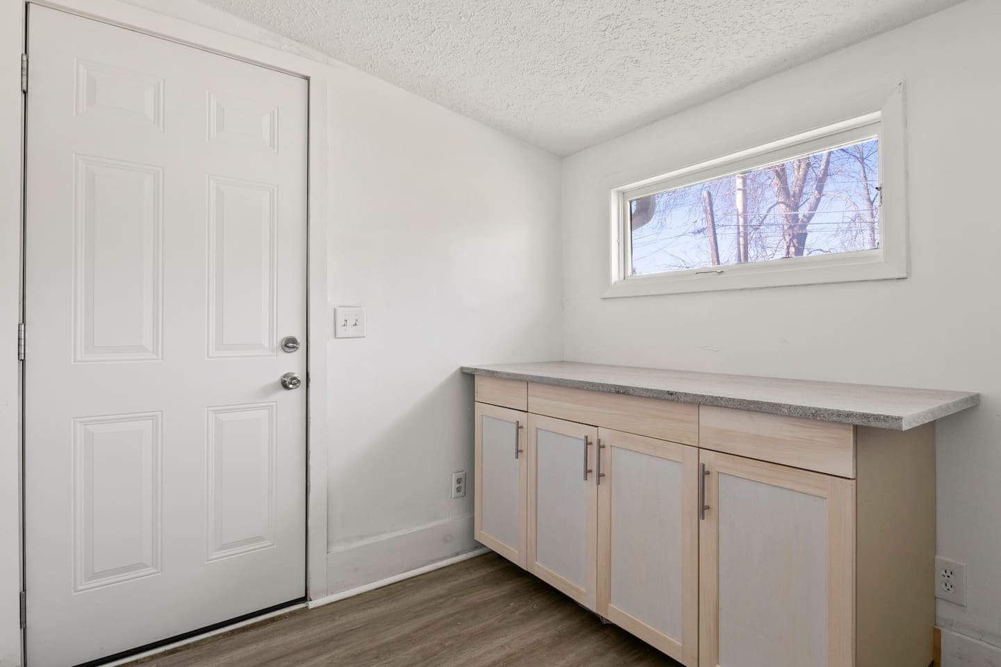 Laundry area with cabinet storage