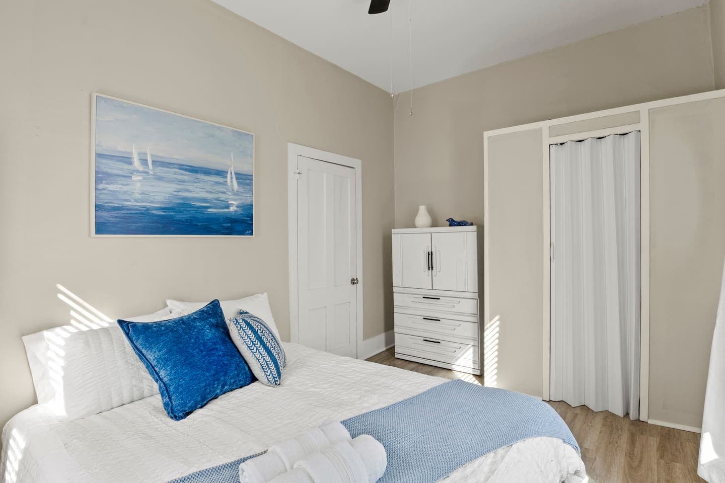 Bed positioned beside the closet doors