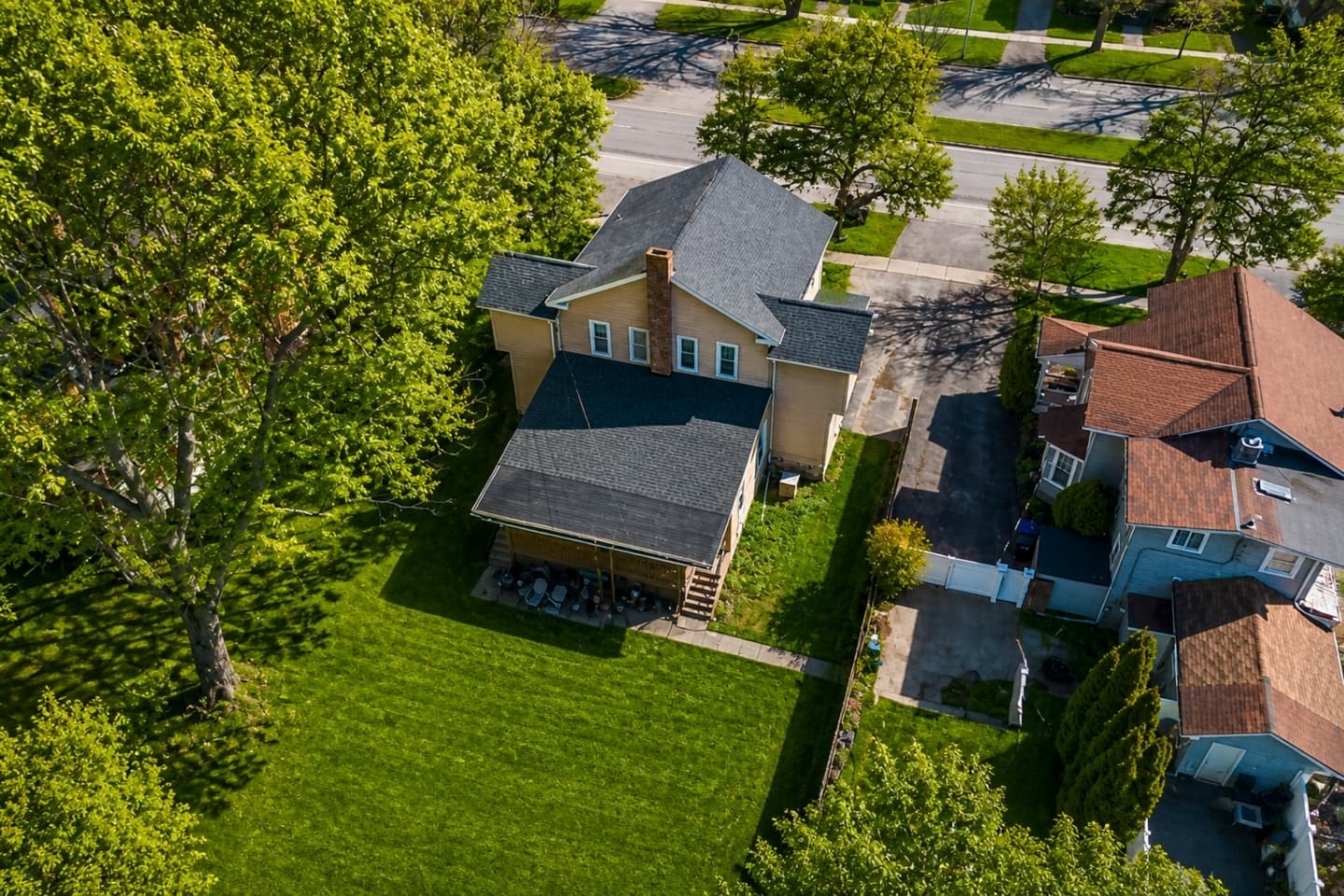 Aerial view of the home and neighboring properties