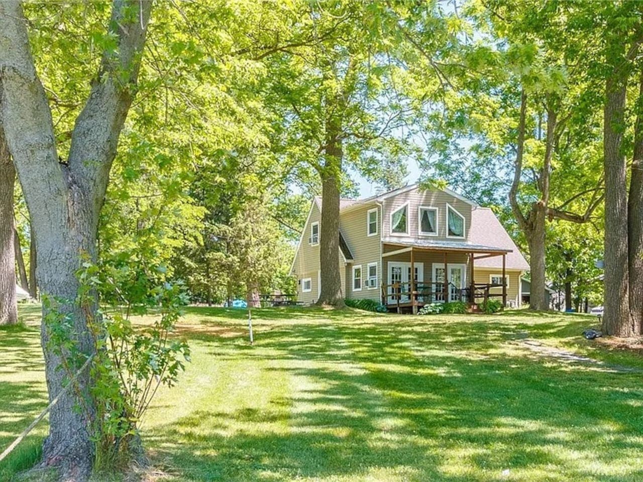 Home surrounded by mature shade trees