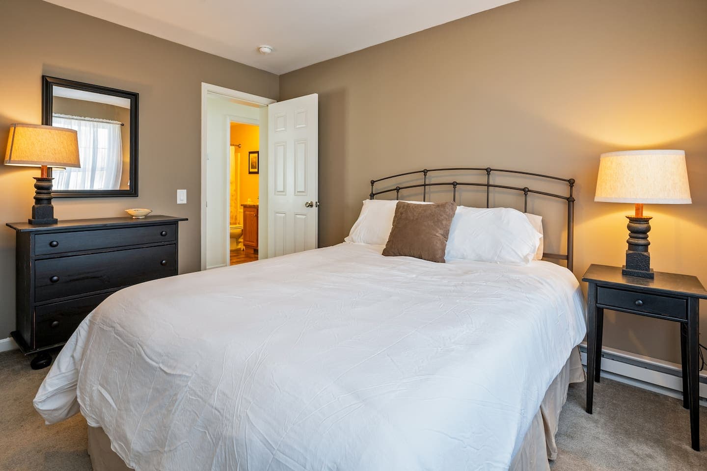 Bedroom with metal bed and warm lighting