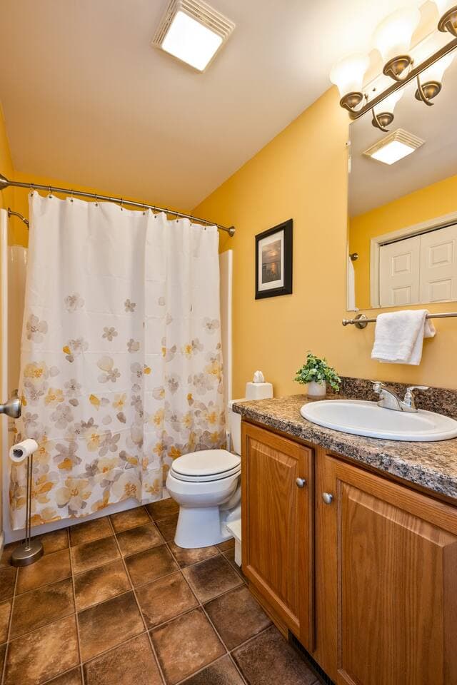 Half bathroom with wood vanity